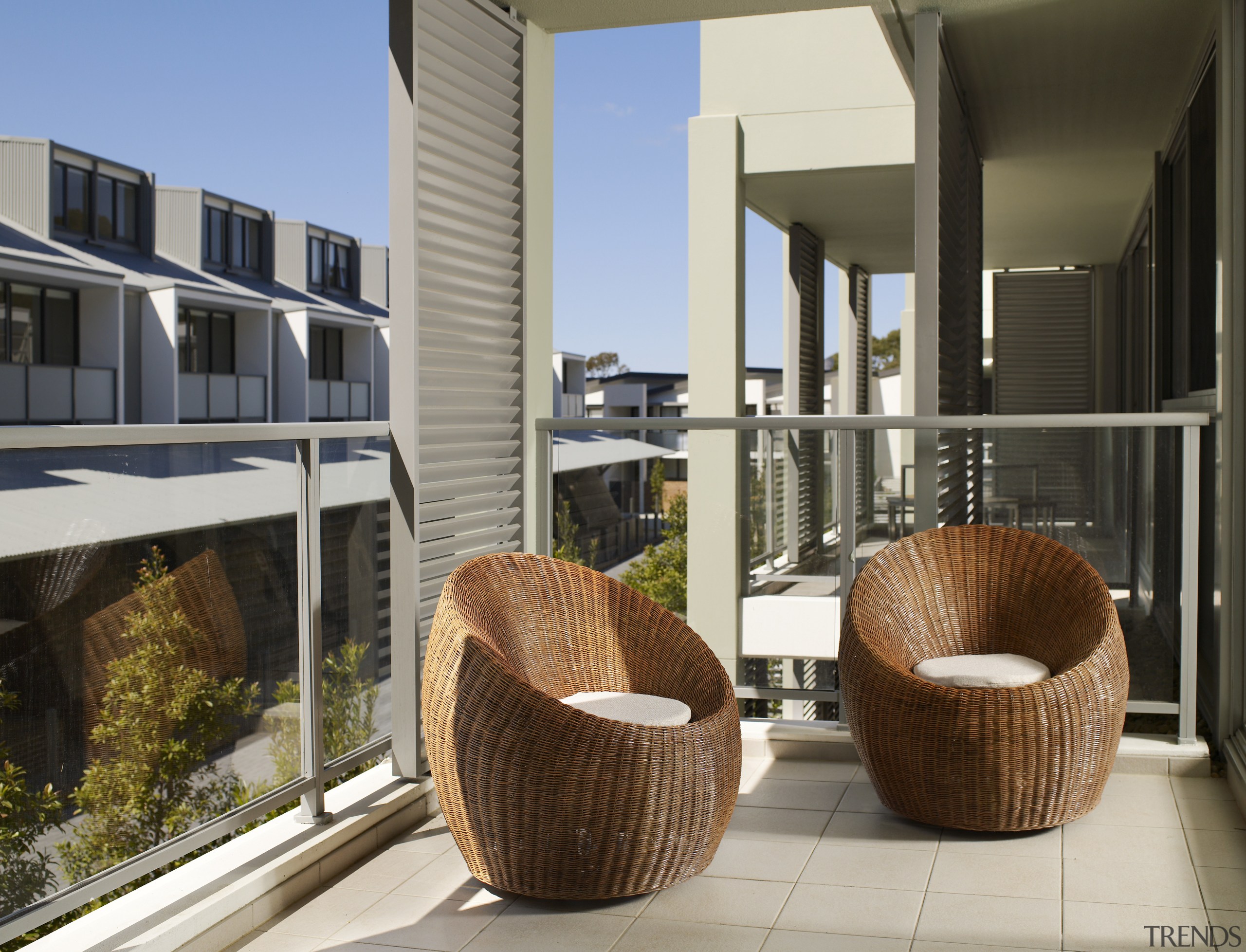 All units feature light spacious interiors, and balcoies. architecture, condominium, furniture, outdoor furniture, real estate, gray, black