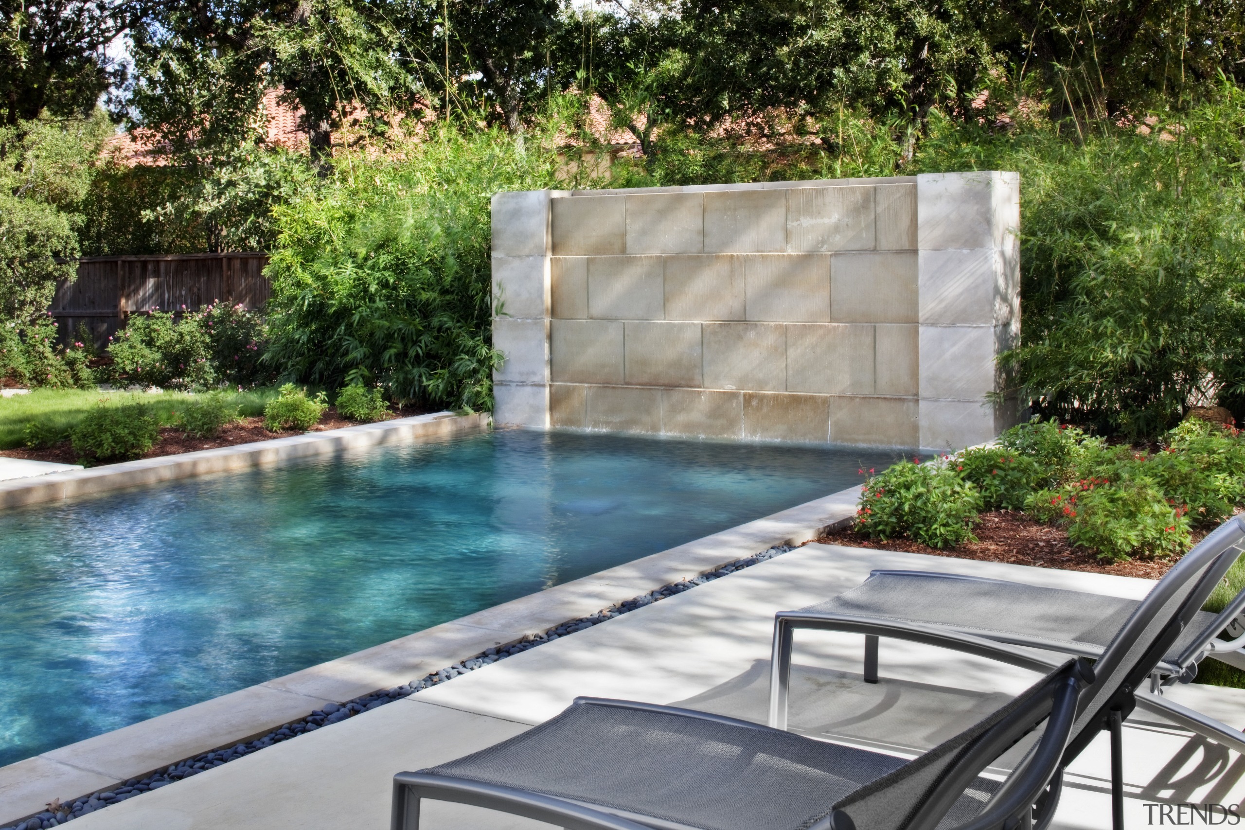 pool and garden with stone feature wall - backyard, landscaping, leisure, outdoor structure, property, real estate, swimming pool, wall, water, water feature, yard, gray