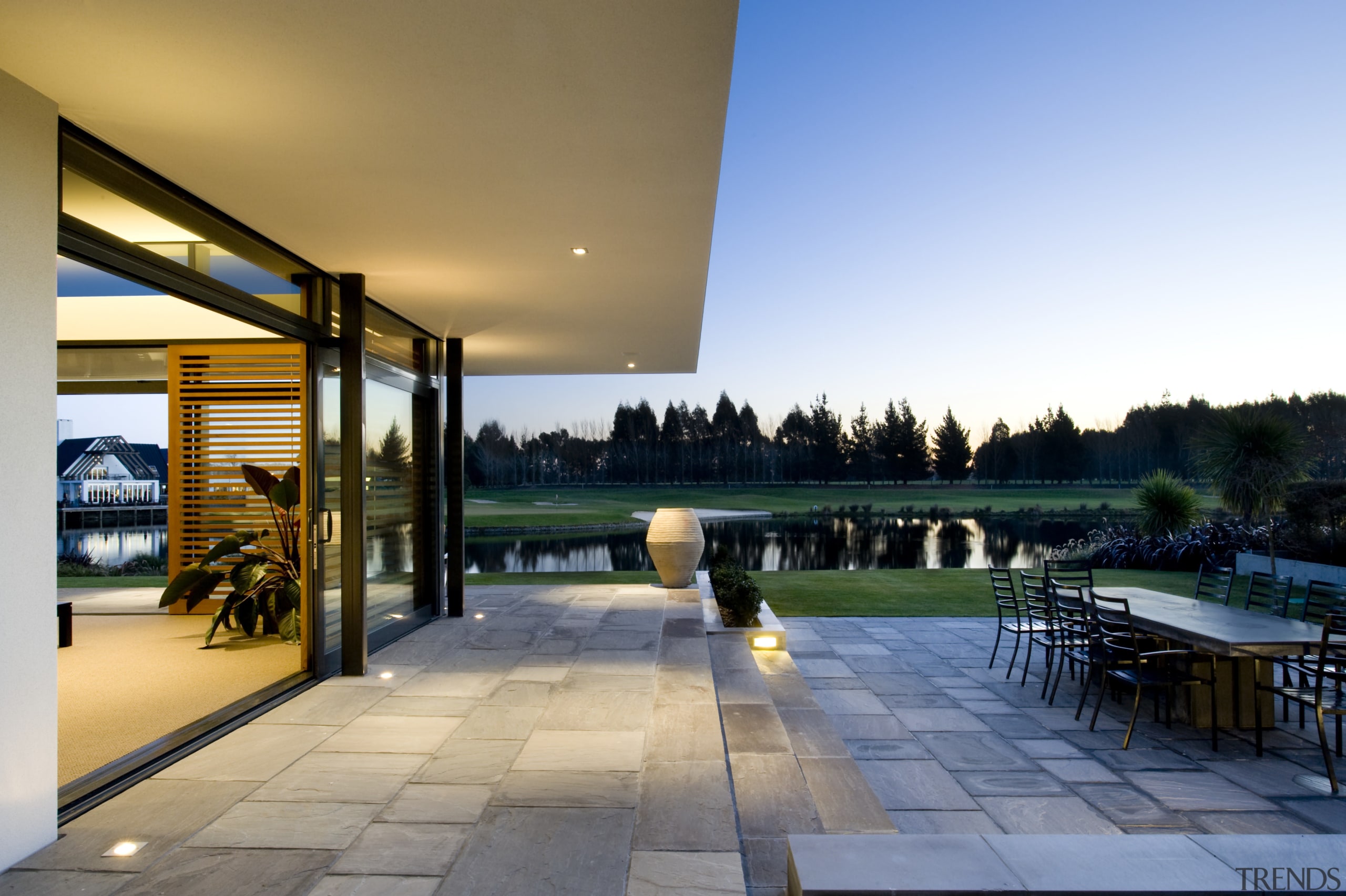This low-lying home sits quietly on the landscape apartment, architecture, condominium, estate, home, house, interior design, property, real estate, roof, sky