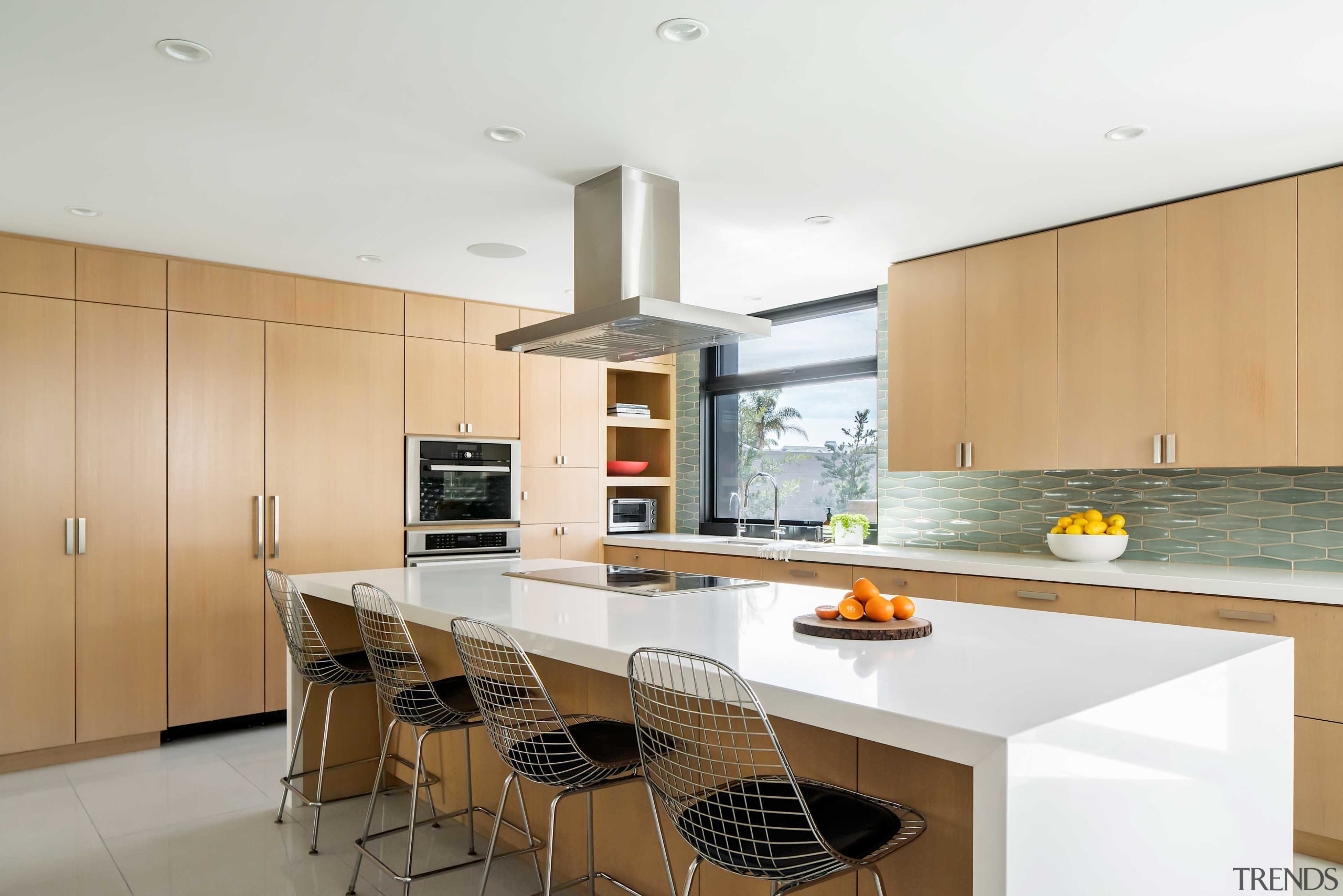 The custom kitchen’s airy feel owes to the 