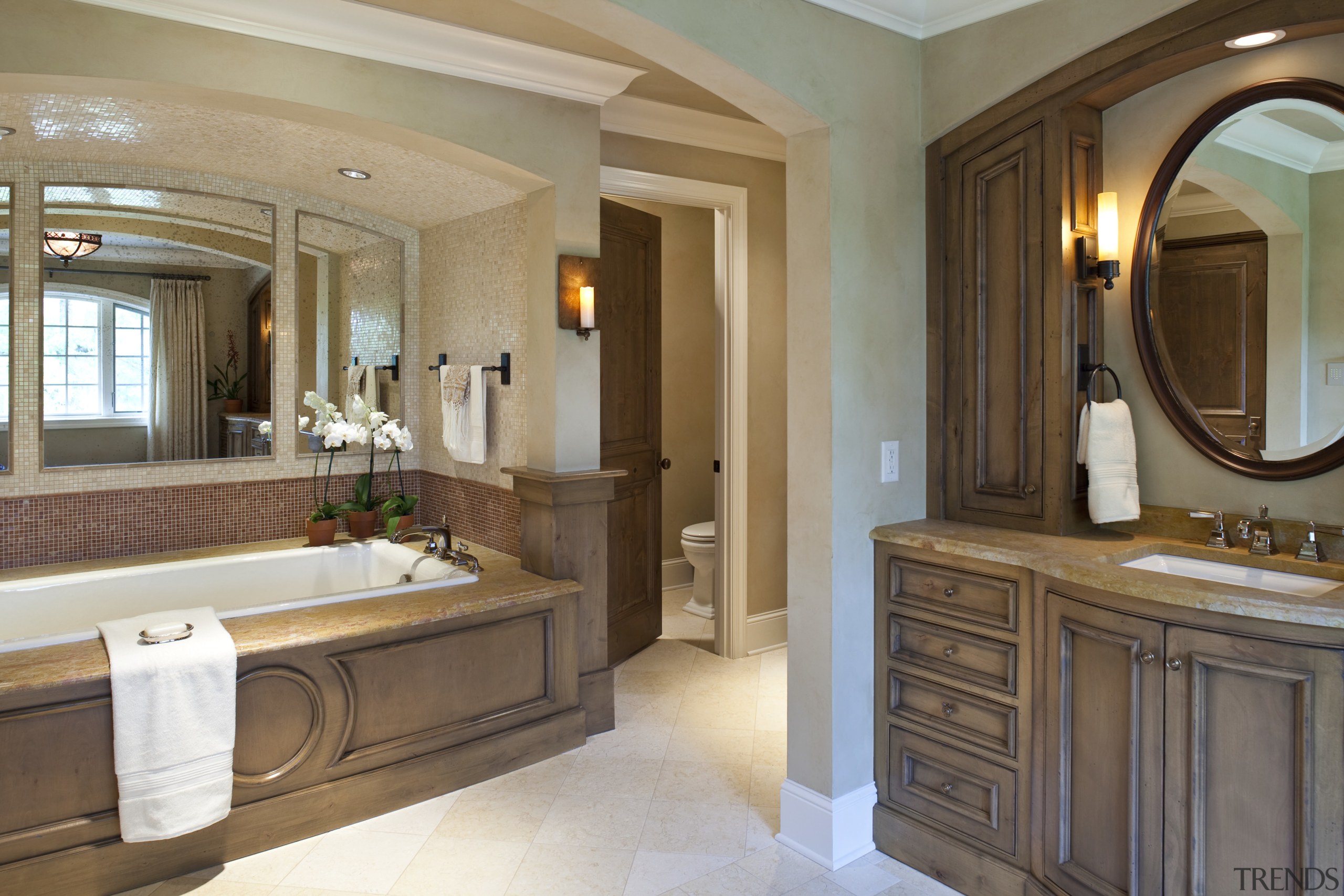 View of a bathroom which features a bathtub bathroom, estate, floor, interior design, room, suite, brown, gray