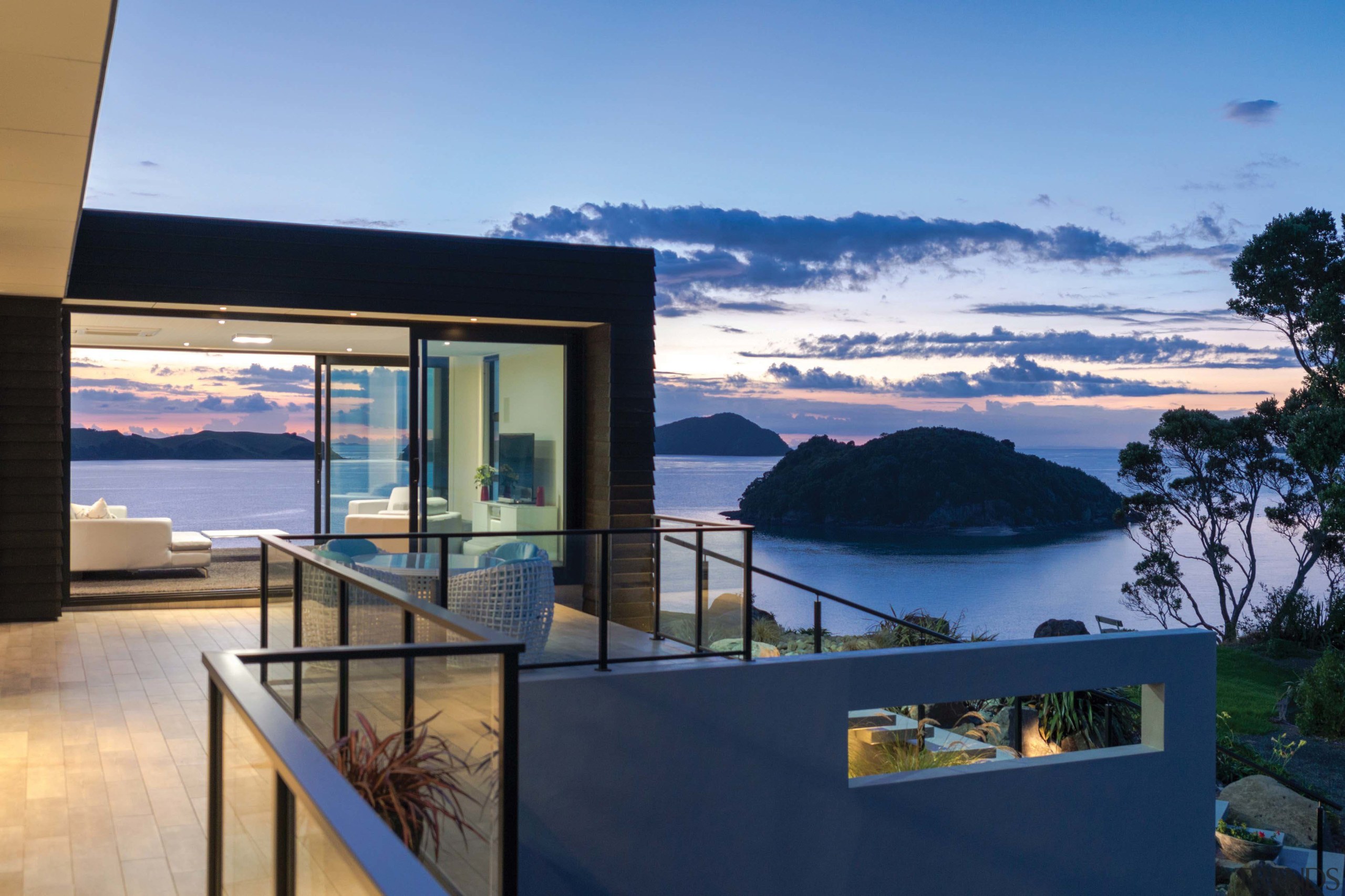 With large sliding doors front and back, this apartment, architecture, estate, home, house, interior design, penthouse apartment, property, real estate, sky, villa, window, teal, blue