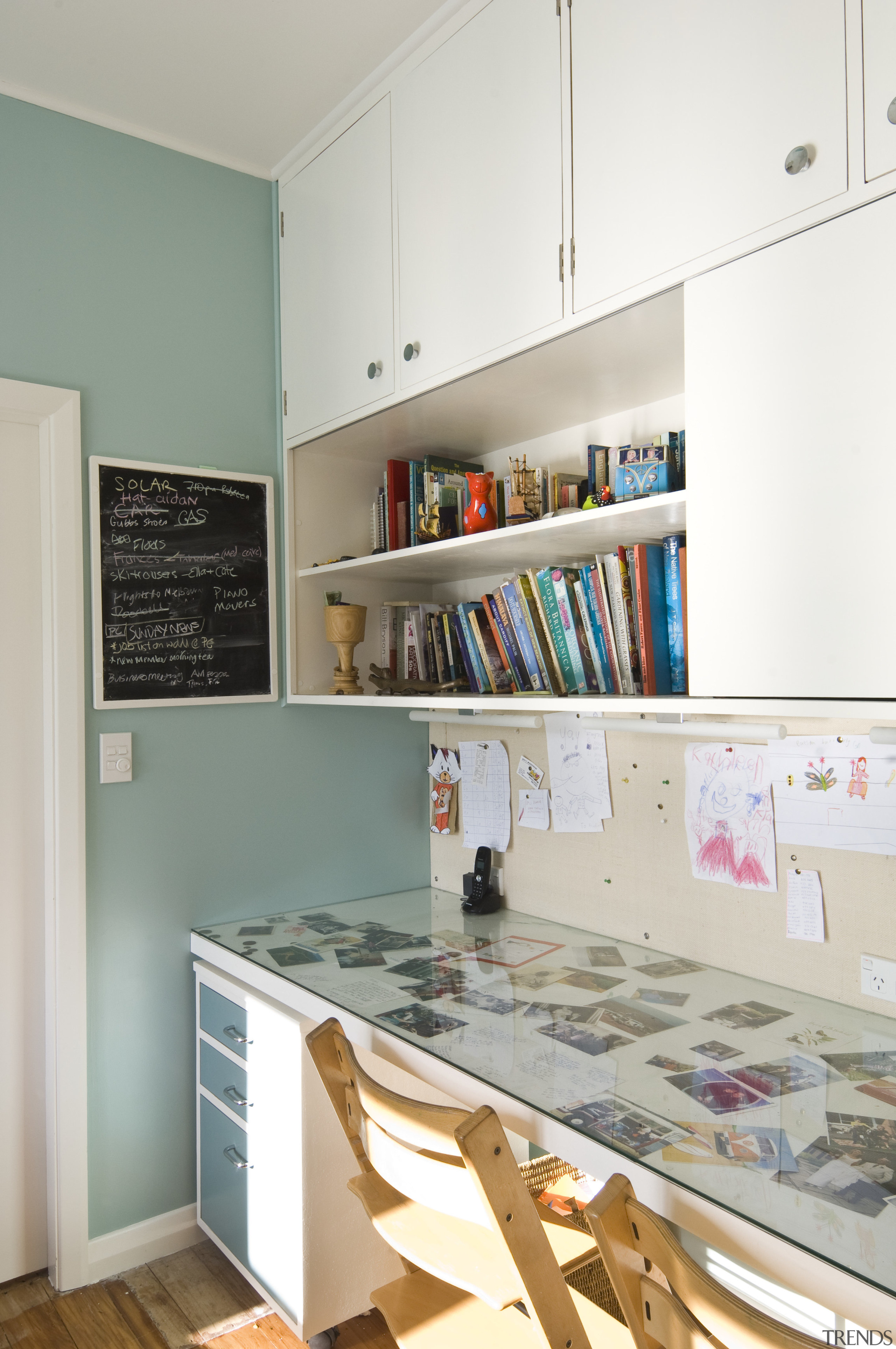 View of a desk within the kitchen space cabinetry, countertop, floor, furniture, interior design, kitchen, room, shelf, shelving, wall, wood, white