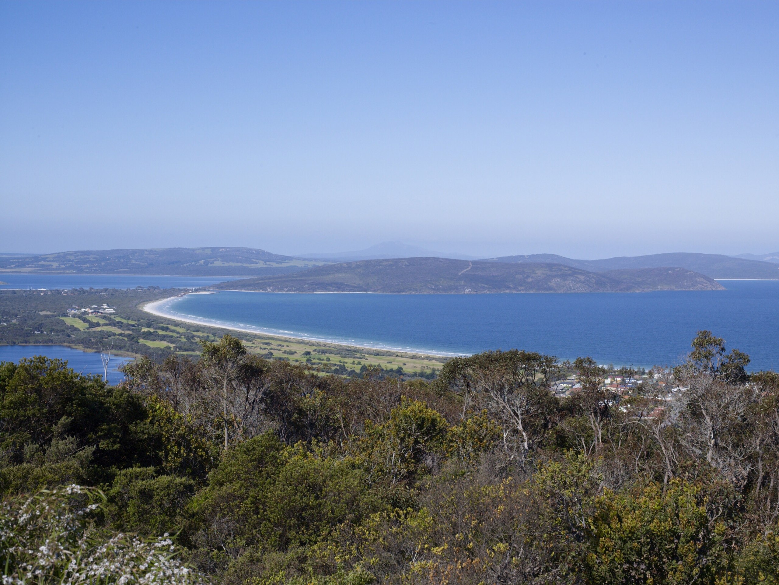 Work is underway to develop the Albany waterfront bay, cape, coast, coastal and oceanic landforms, headland, highland, hill, horizon, inlet, loch, ocean, peninsula, promontory, sea, shrubland, sky, tree, teal