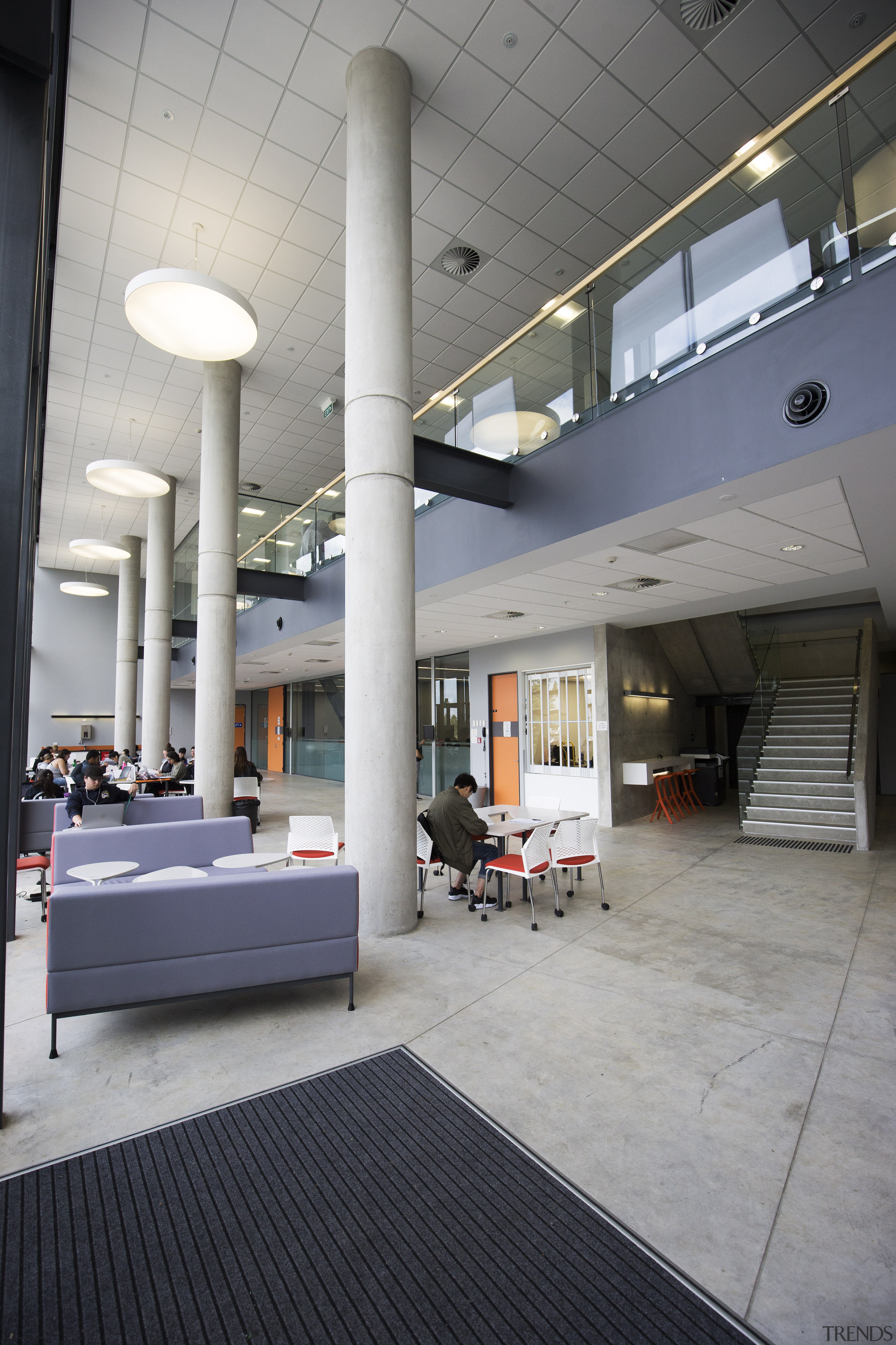 The double-height atrium of the grass-roofed podium, next architecture, building, ceiling, daylighting, floor, flooring, interior design, lobby, structure, gray