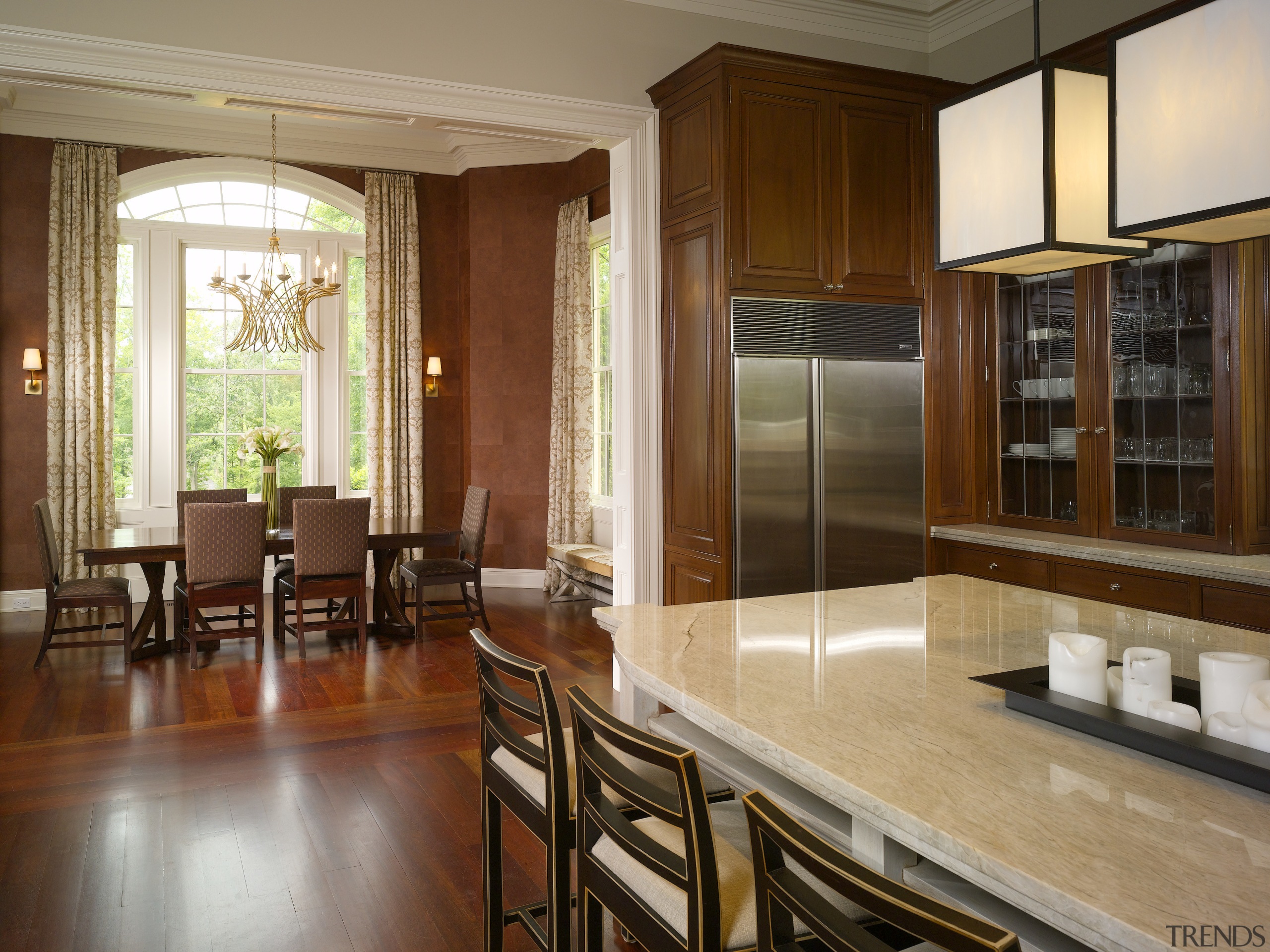 View of kitchen in this Regency-styled house which cabinetry, countertop, dining room, floor, flooring, hardwood, interior design, kitchen, real estate, room, window, wood flooring, brown