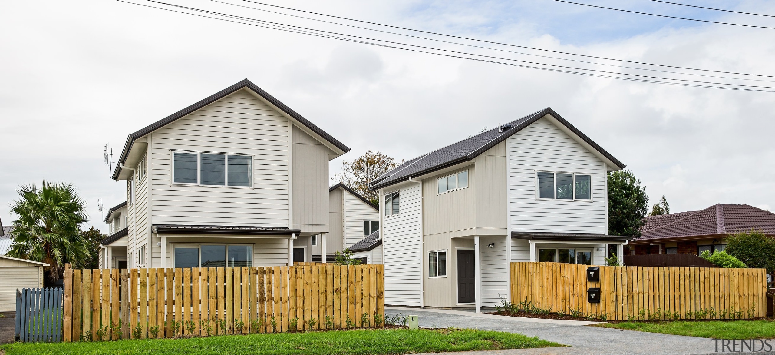 Eight new homes in the Richardson-Howell development, owned building, cottage, facade, farmhouse, home, house, neighbourhood, property, real estate, residential area, siding, suburb, white
