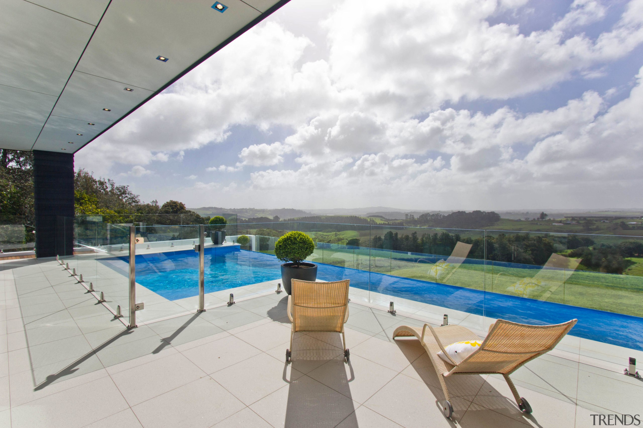 Infinity pool for country house by Mayfair Pools. estate, home, house, leisure, property, real estate, sky, swimming pool, vacation, villa, gray