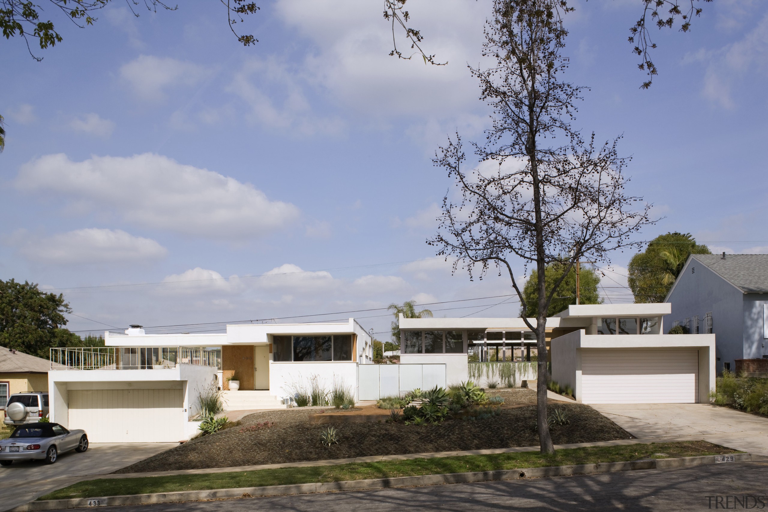 Exterior view of this contemporary home that was architecture, cottage, elevation, estate, facade, home, house, property, real estate, residential area, roof, gray