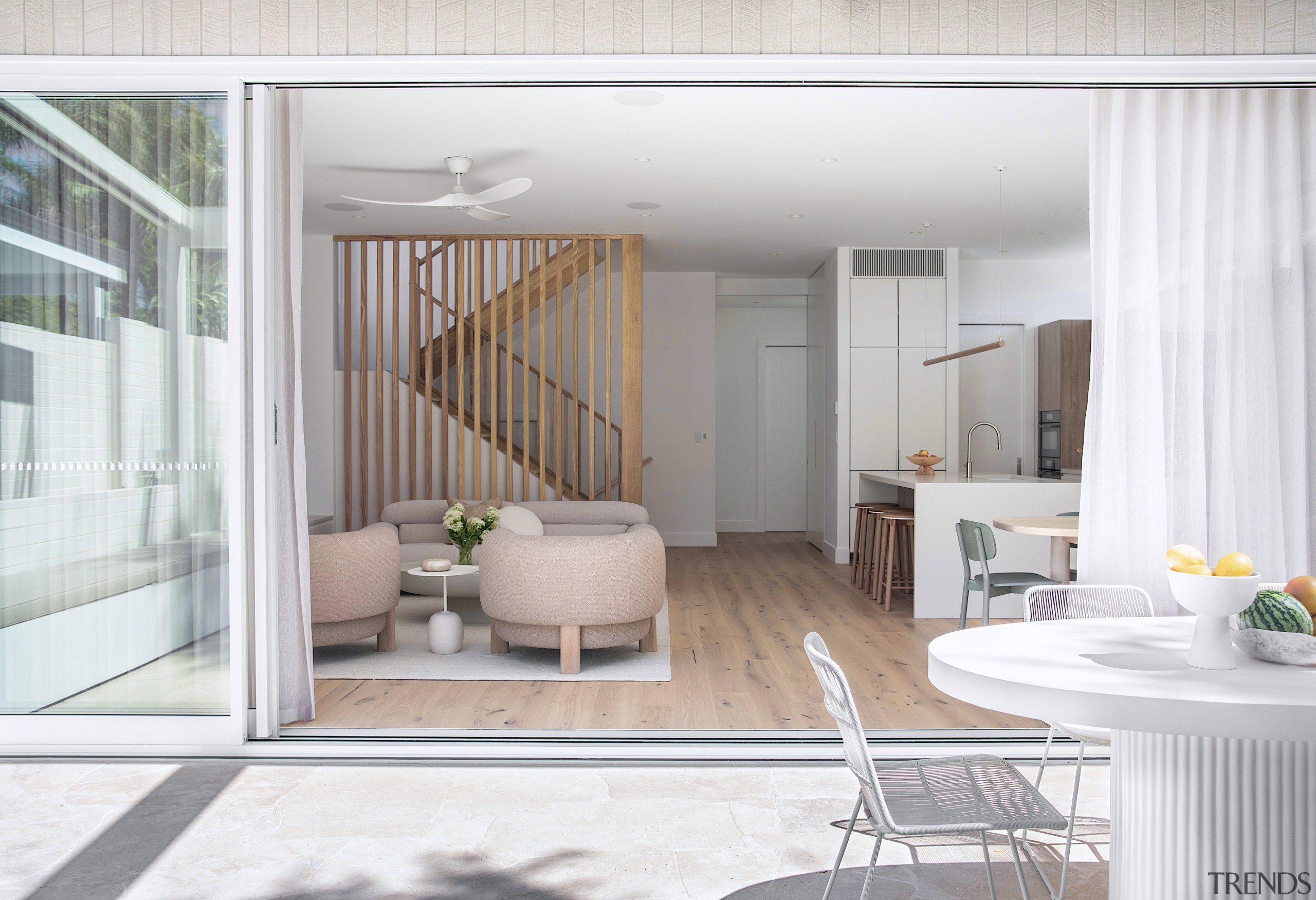 Expansive sliders across the rear connect the open-plan 