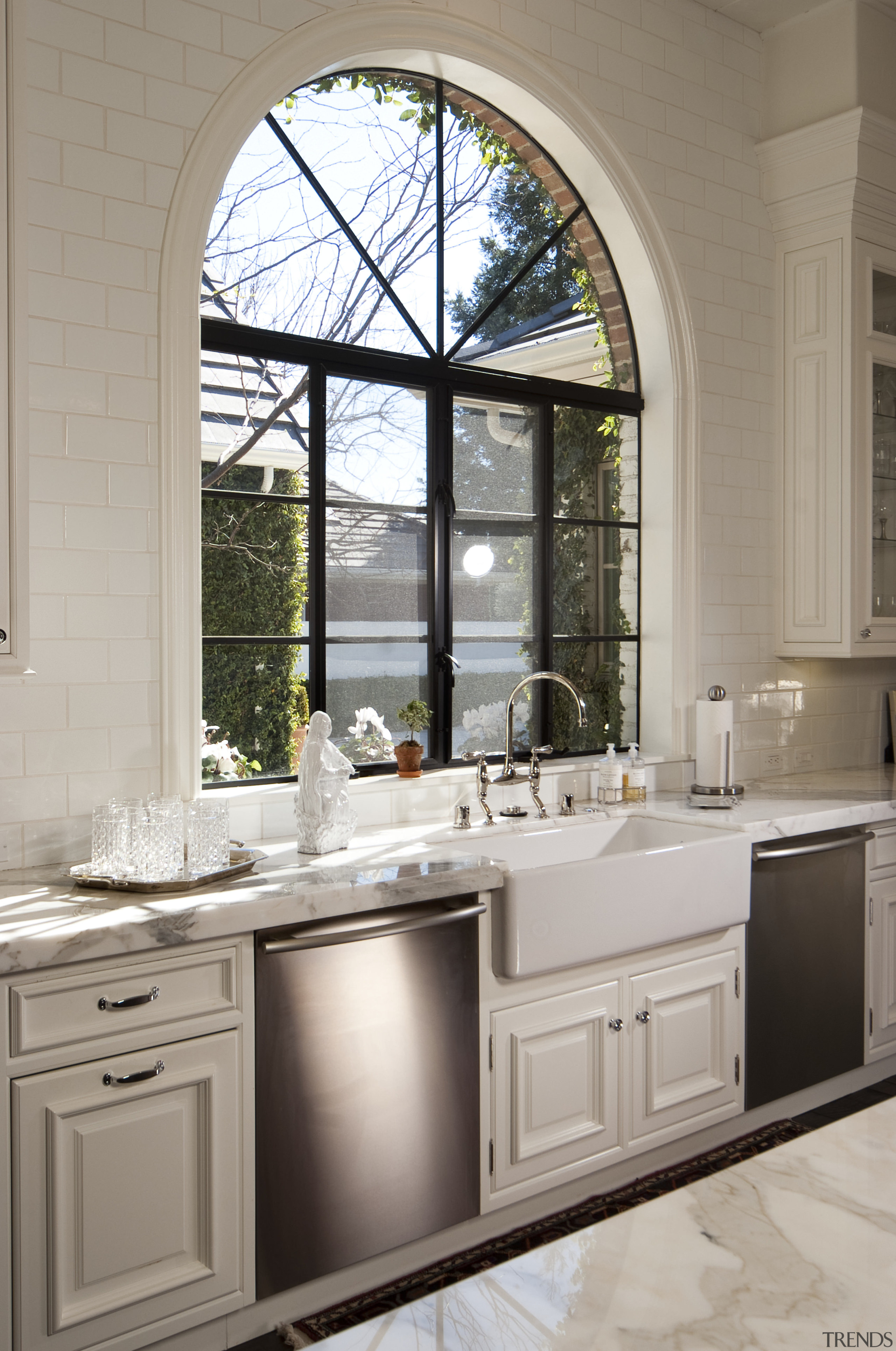 arched window behind farmhouse sink and twin dishwashers, bathroom, cabinetry, countertop, cuisine classique, home, interior design, kitchen, sink, window, gray