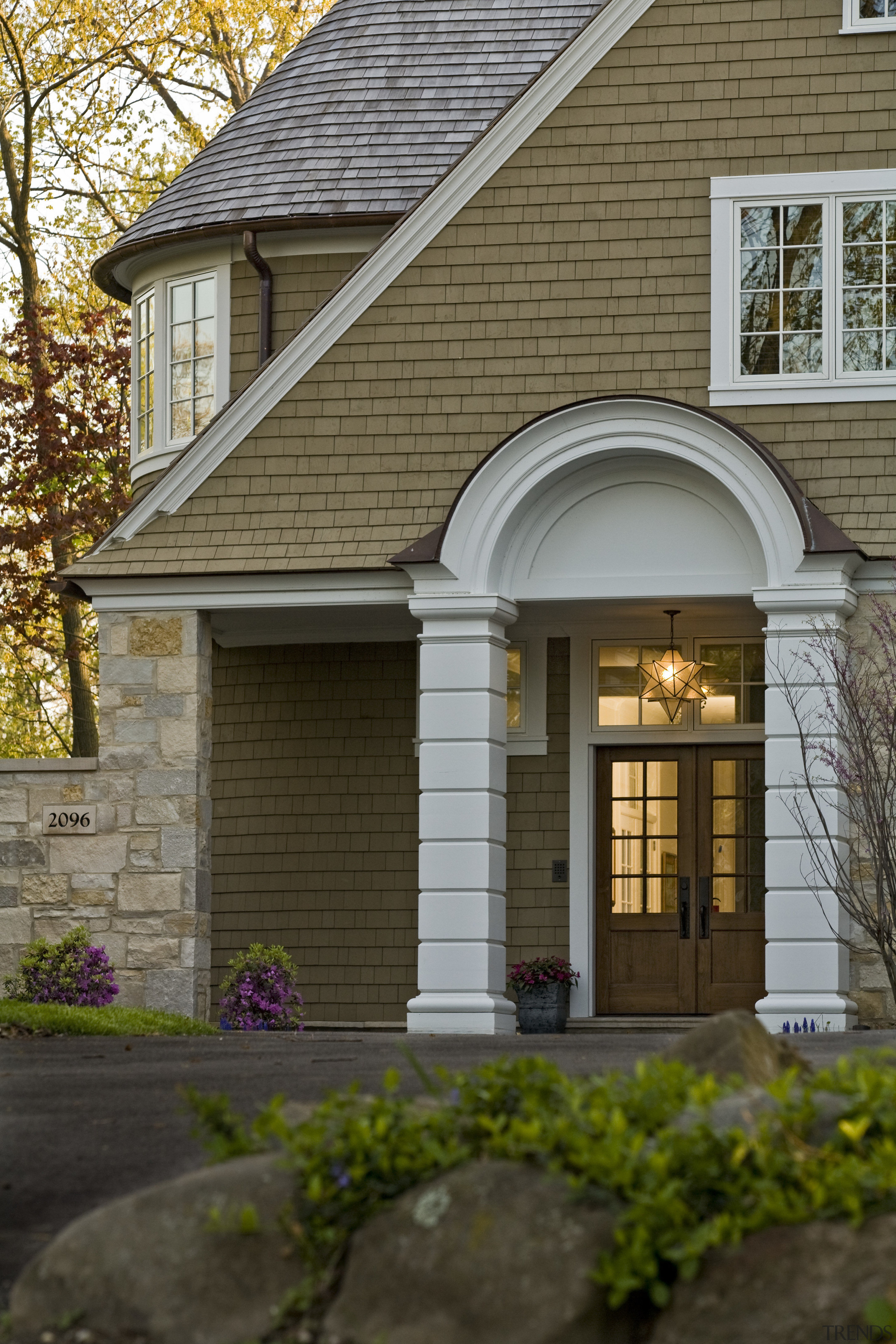 Exterior view of house featuring asymmetrical gabled roof building, cottage, estate, facade, home, house, porch, property, real estate, residential area, roof, siding, window, brown, gray