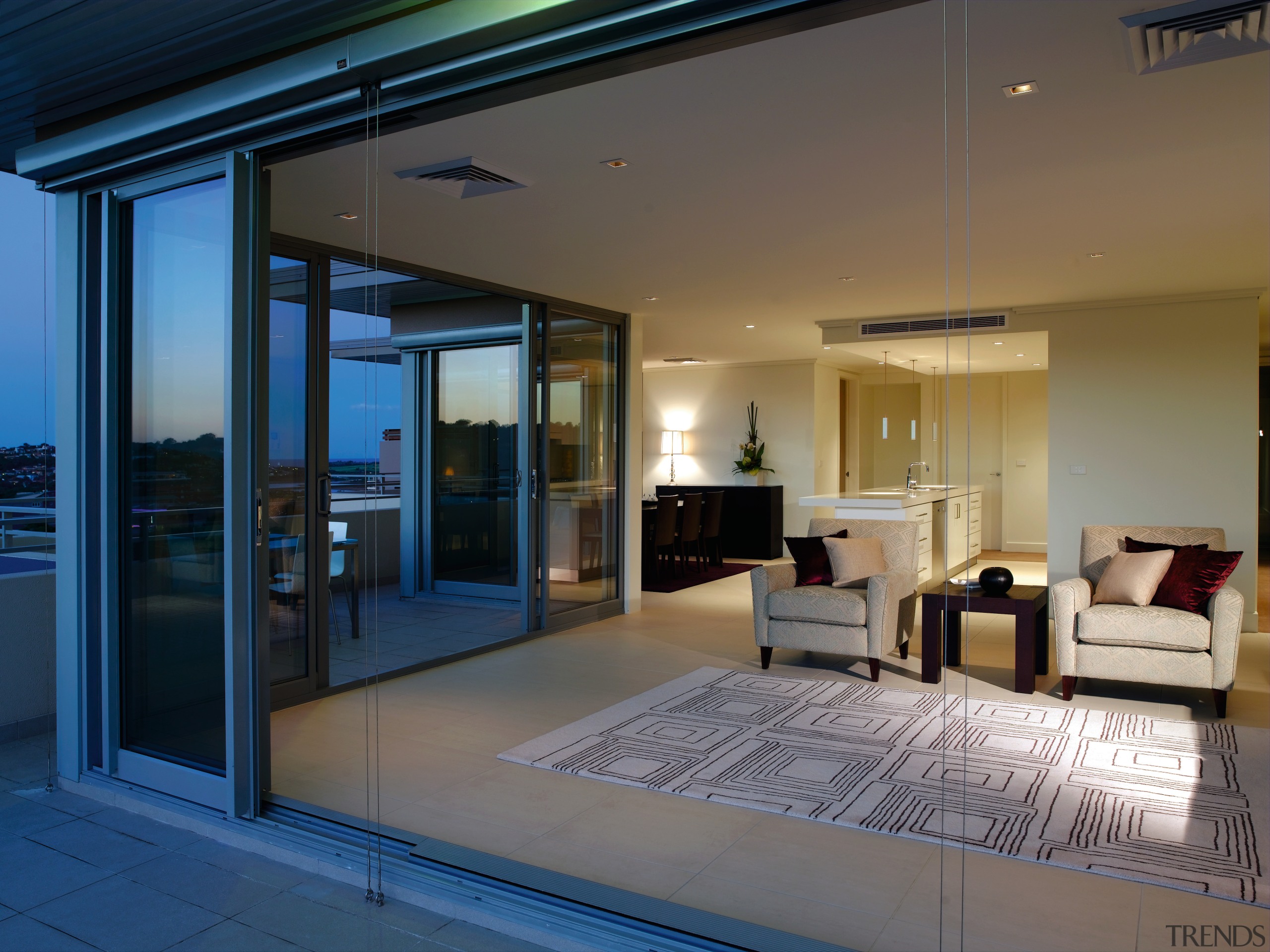 A view of the living area featuring carpet door, home, house, interior design, lighting, property, real estate, window, gray