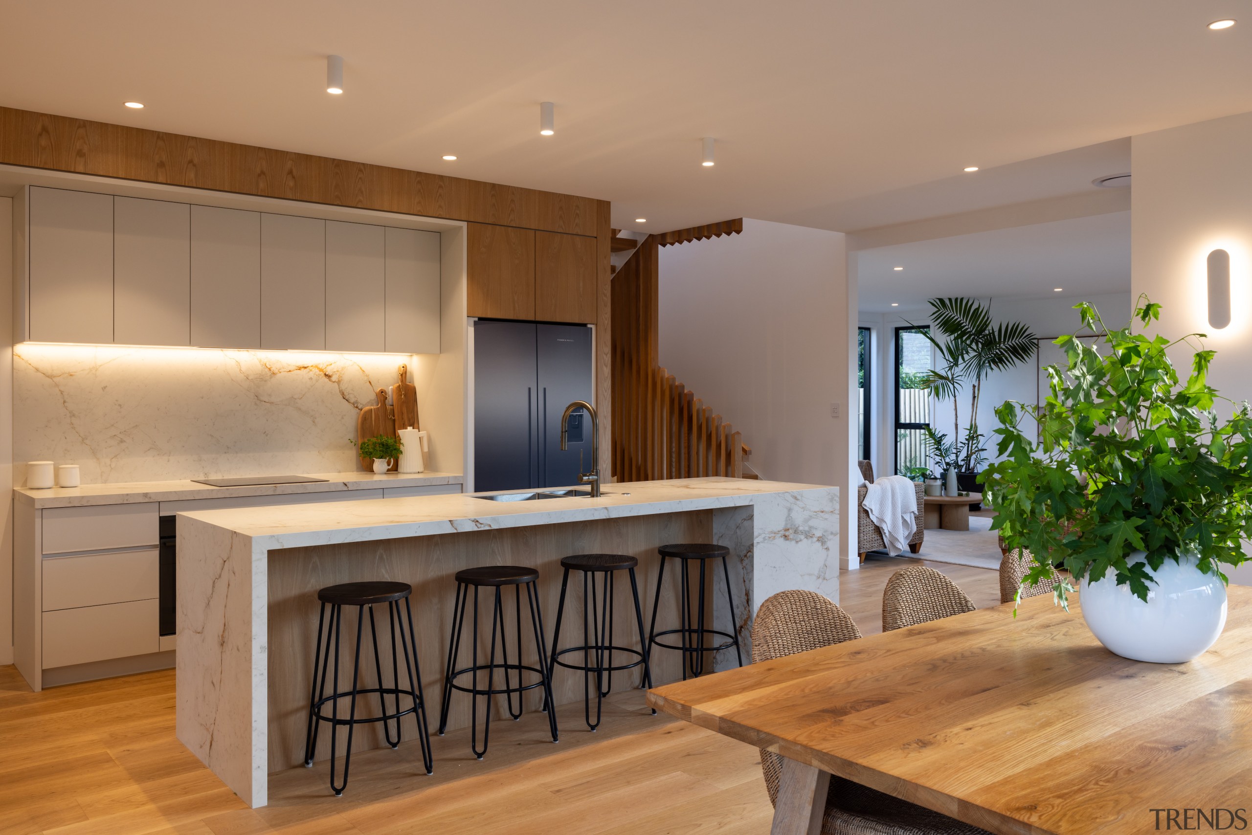 Overhead cabinetry and concealed storage ensure everyday essentials 