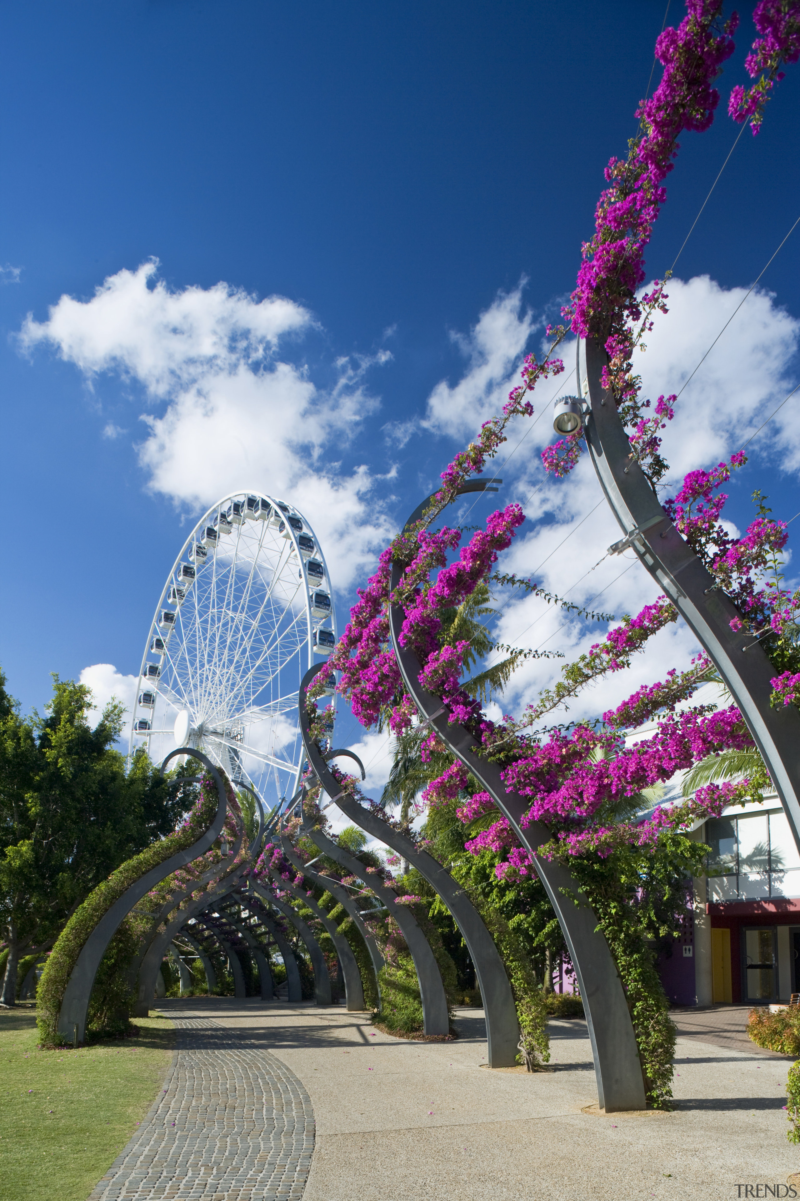 Image of a development which is part of amusement park, flora, flower, landmark, leisure, nature, park, plant, recreation, sky, spring, tourist attraction, tree, blue