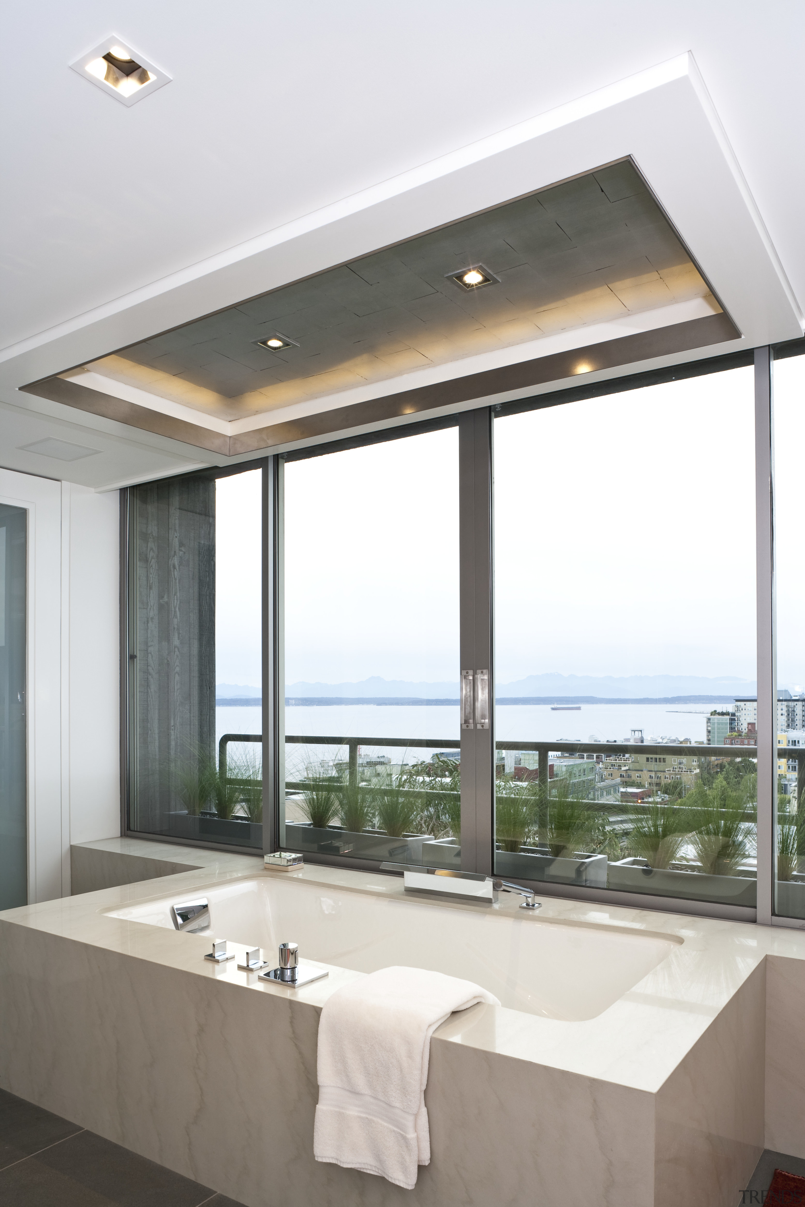 View of a bathroom which features a bathtub architecture, ceiling, daylighting, house, interior design, real estate, window, white, gray