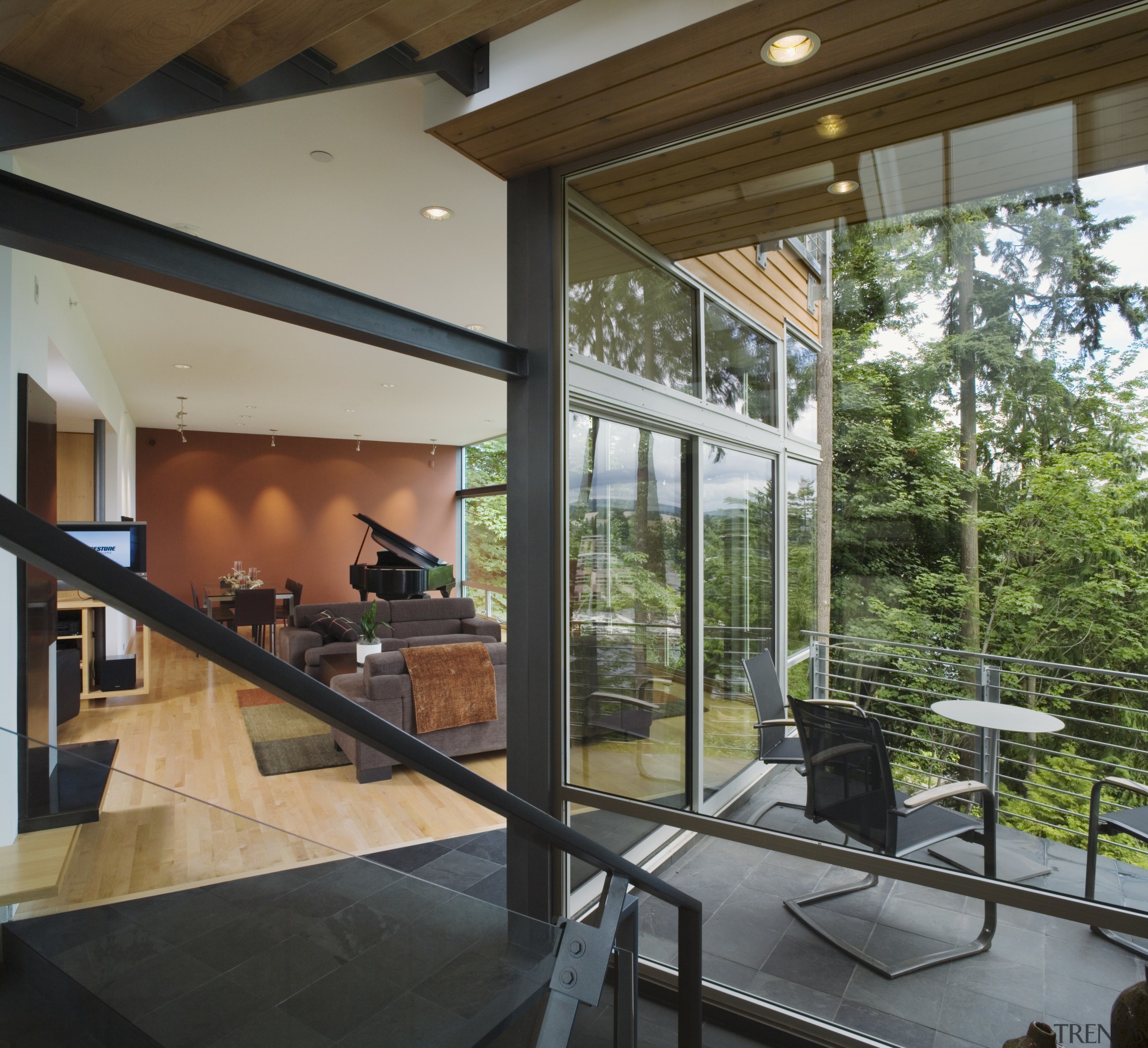 Floor-to-ceiling windows provide city views, and a sense architecture, daylighting, glass, house, interior design, real estate, window, gray, brown