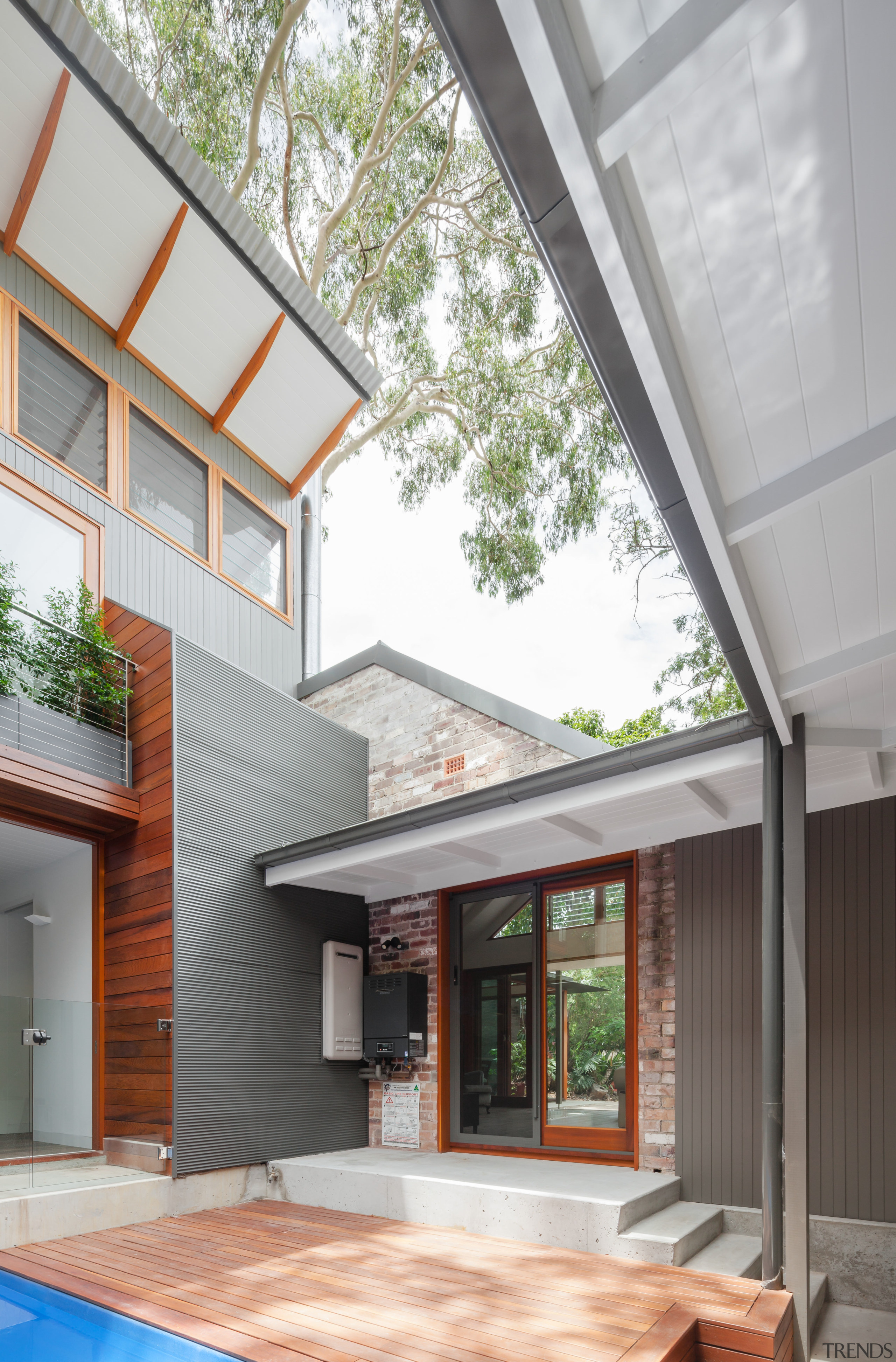 Here, a brick facade of the original dwelling architecture, courtyard, daylighting, estate, facade, home, house, real estate, residential area, roof, siding, window, gray, white