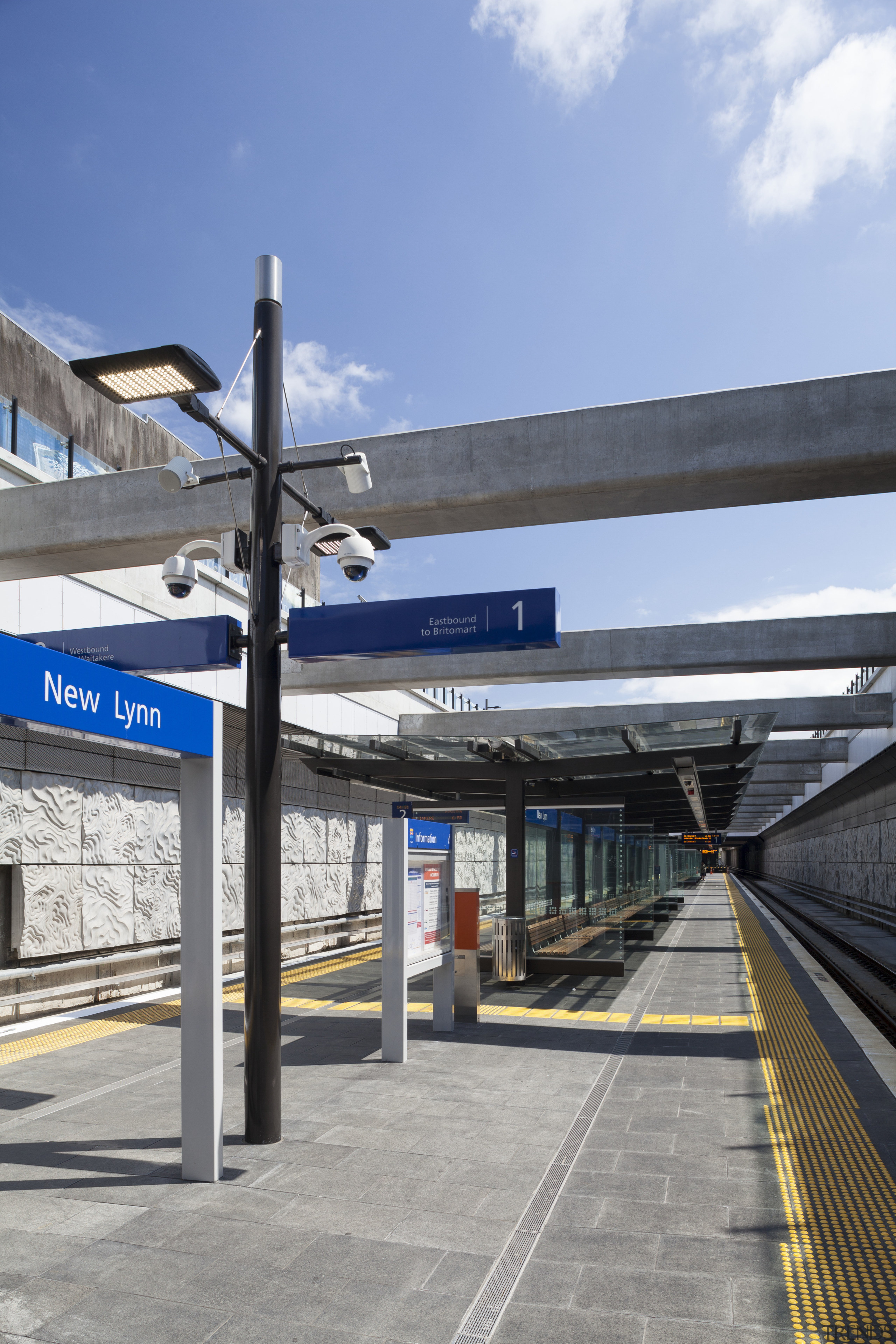 Railway stations through the region, including New Lynn, architecture, building, city, metropolitan area, road, sky, structure, transport, gray, teal
