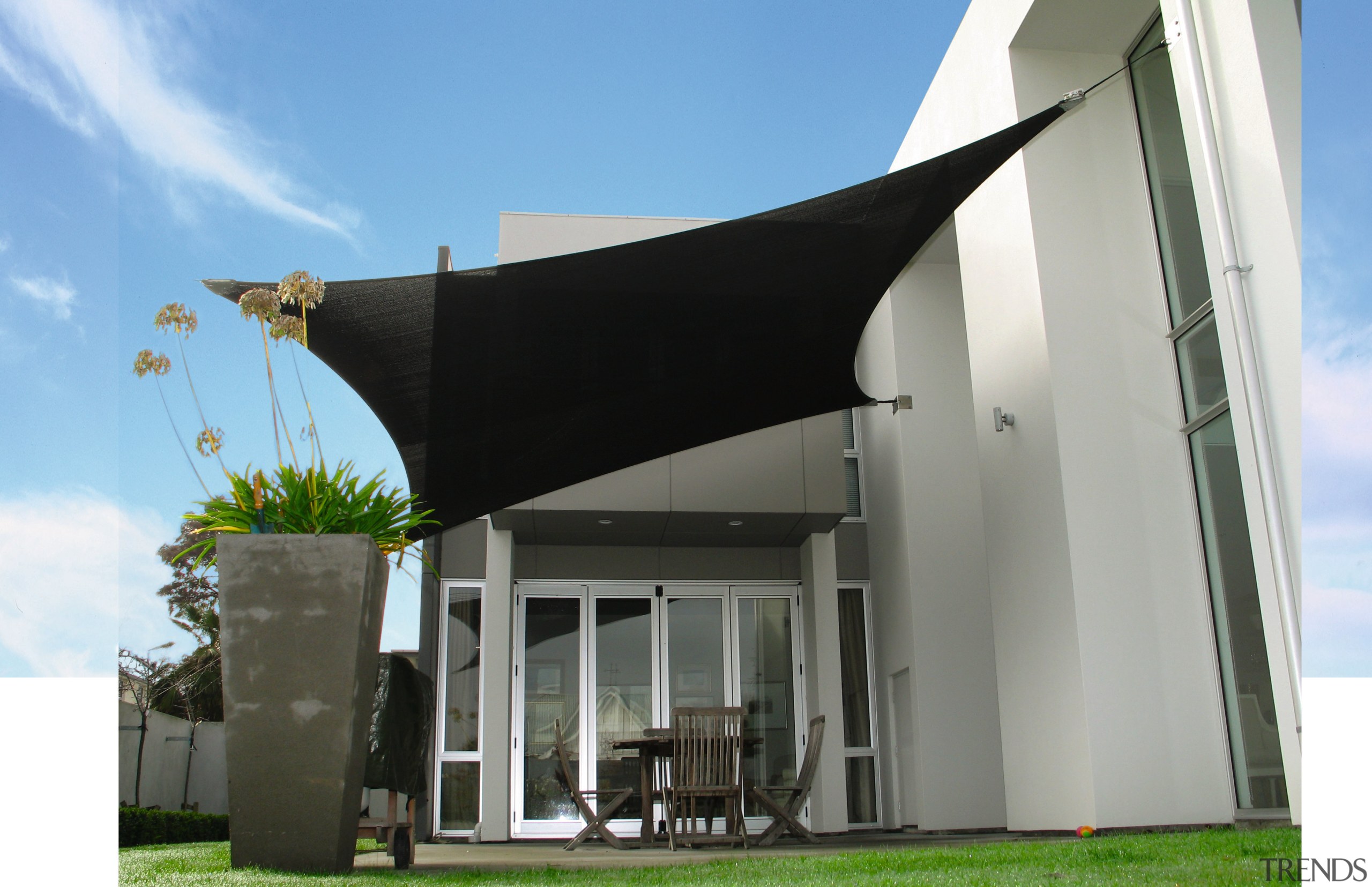 A view of a shade system. - A architecture, facade, house, shade, gray