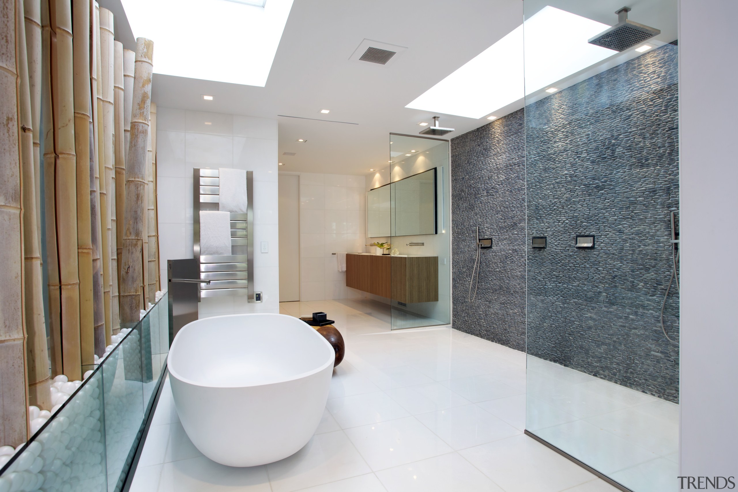 The wet-area shower has a floor-to-ceiling pebble wall. architecture, bathroom, estate, floor, flooring, interior design, product design, property, real estate, tile, gray