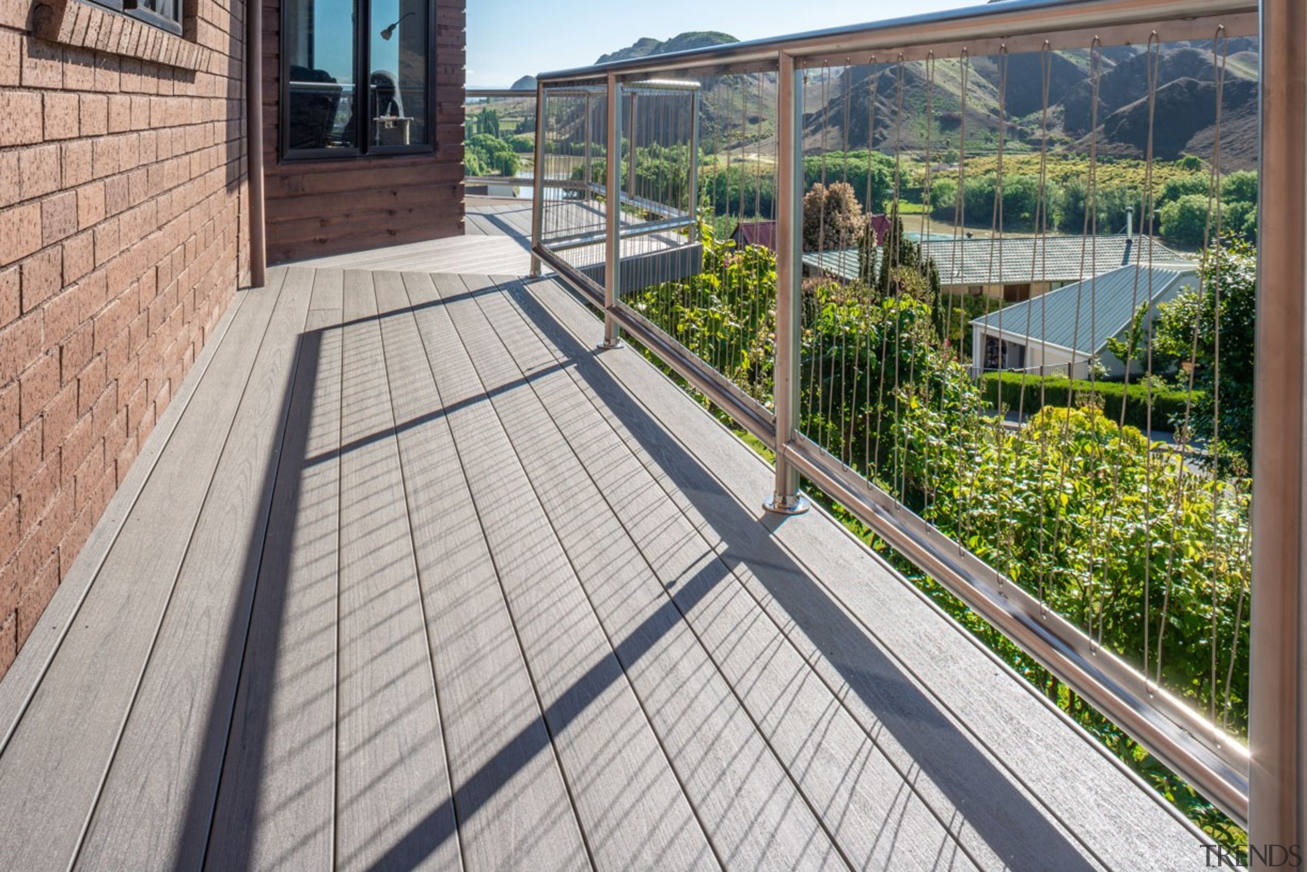 A Superb Deck Finish Is Achieved With TimberTechs architecture, balcony, deck, handrail, outdoor structure, property, real estate, roof, walkway, gray