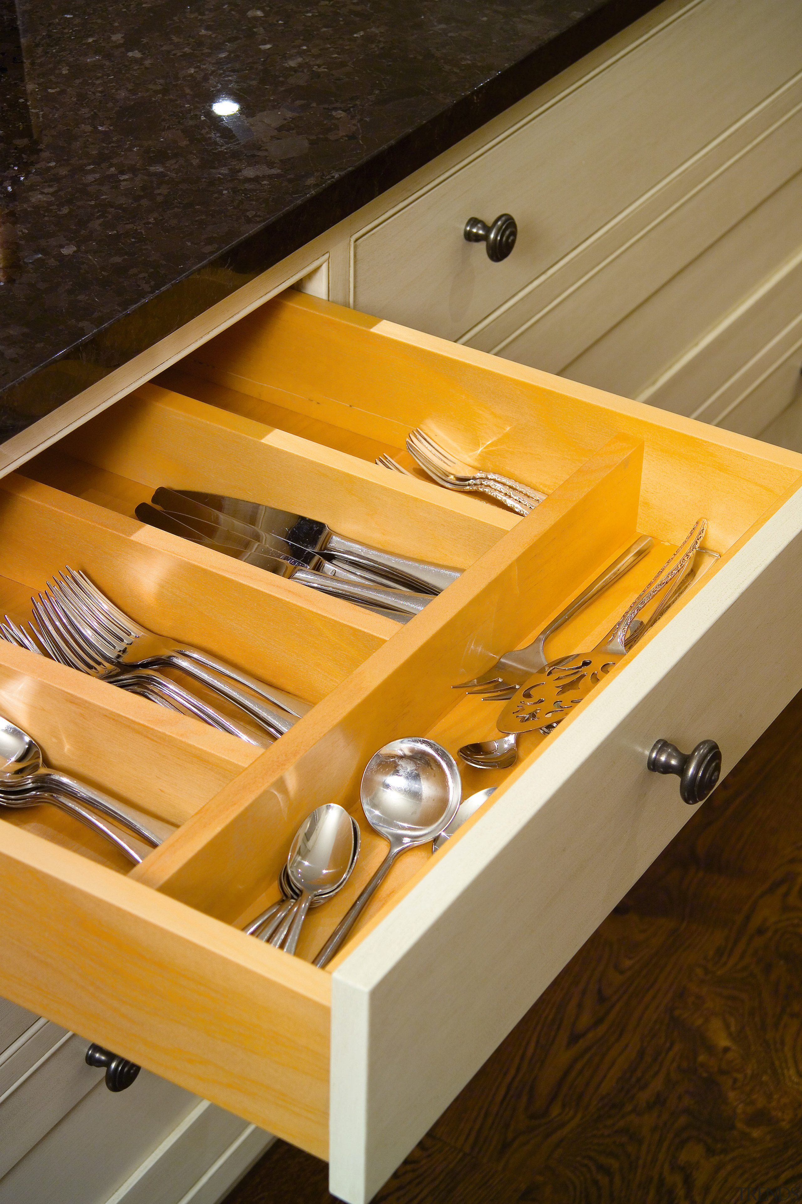 A view of this traditional kitchen featuring antique drawer, furniture, product design, table, wood, yellow, brown, orange