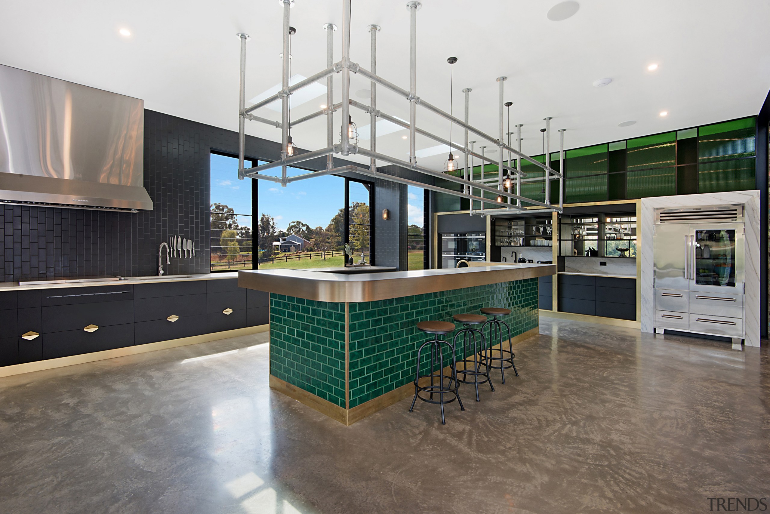 A green brick island finish pops within the 