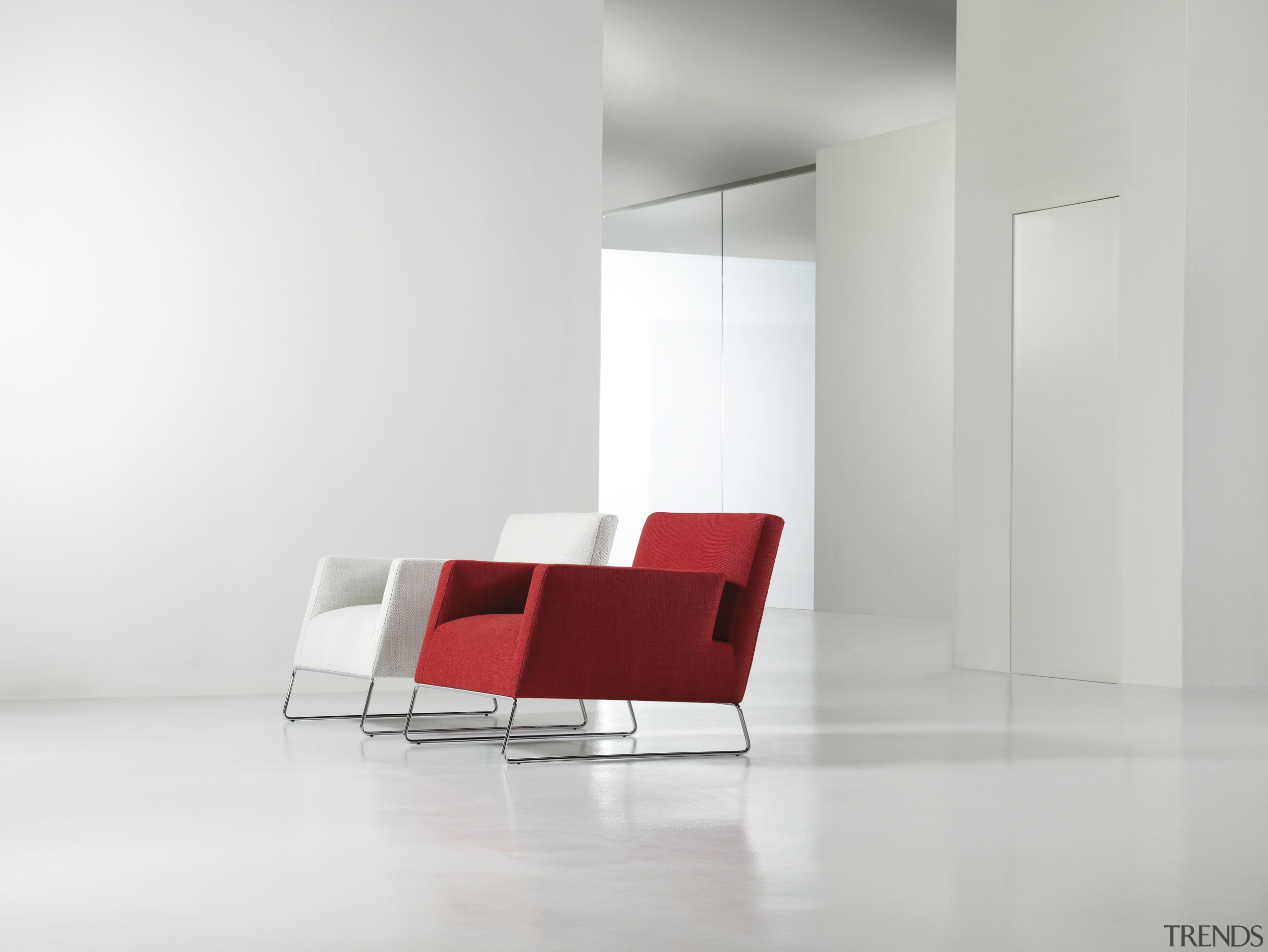 Contemporary red and white chairs with white walls. angle, chair, couch, floor, furniture, interior design, product design, table, white, gray