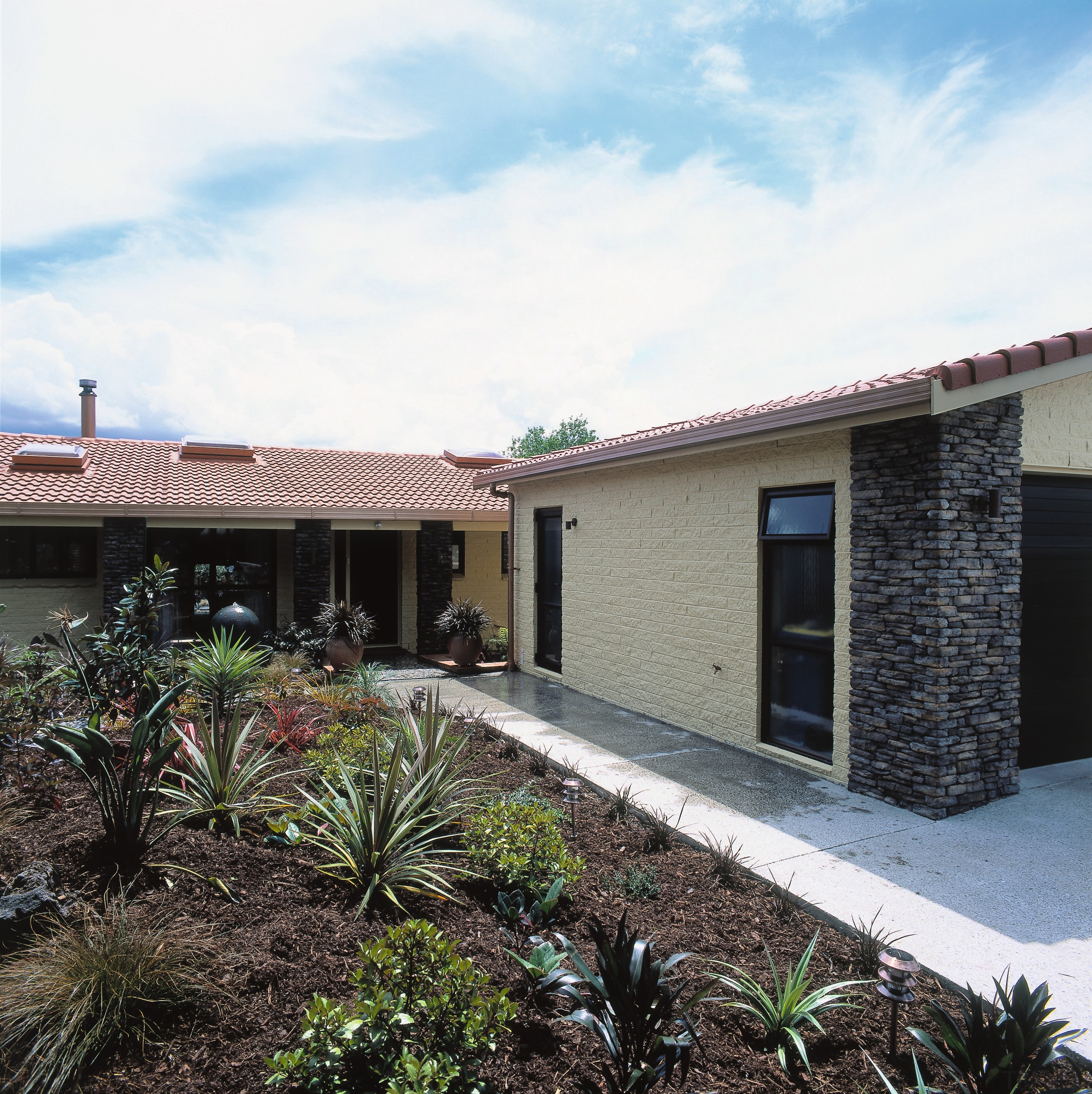 The result of a transformation from a hacienda-style architecture, courtyard, estate, facade, hacienda, home, house, property, real estate, residential area, roof, villa, window, white, black