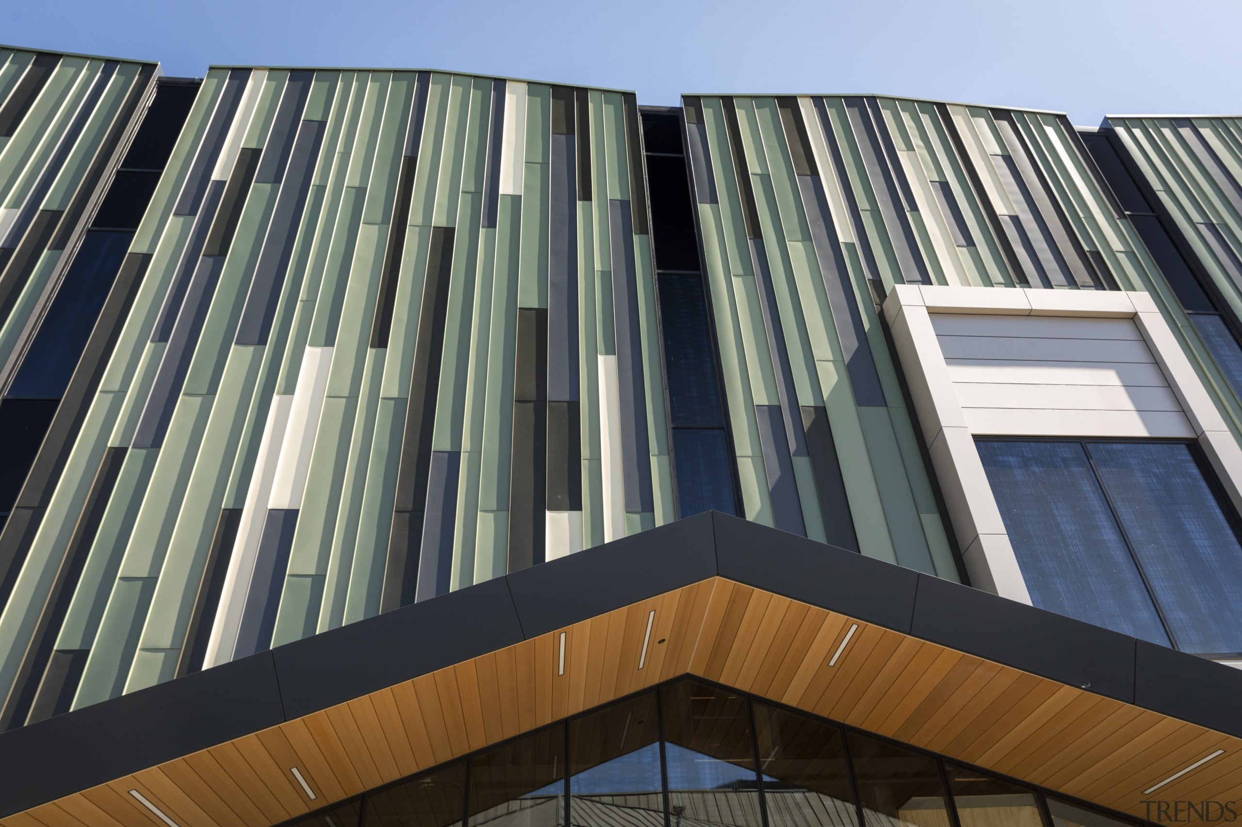 A colour coated steel and glass facade on architecture, building, commercial building, condominium, corporate headquarters, daylighting, daytime, elevation, facade, headquarters, line, metropolis, metropolitan area, mixed use, roof, sky, skyscraper, tower block, urban area, window, gray, black