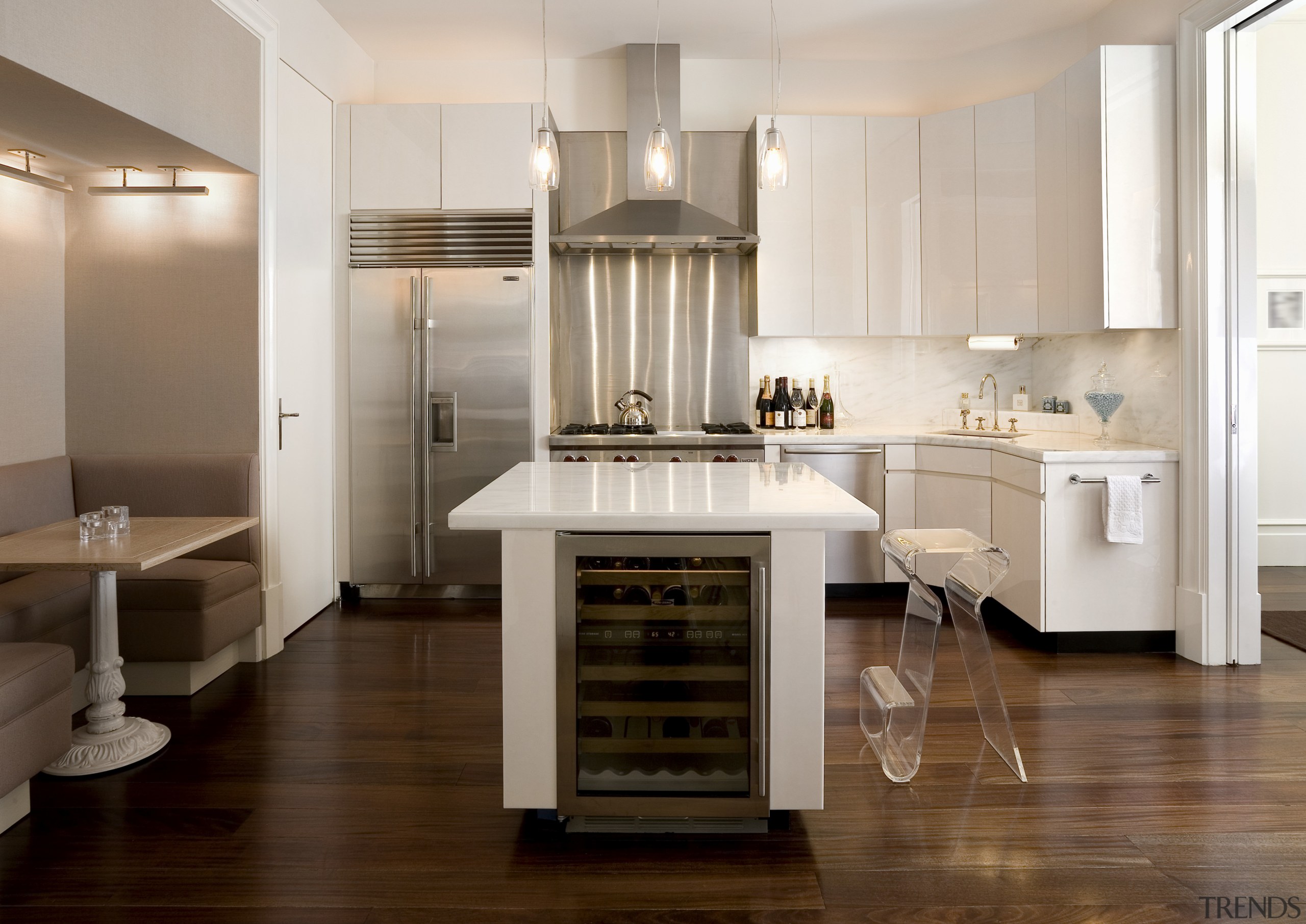 View of kitchen featuring mahogany floors, stainless steel cabinetry, countertop, cuisine classique, floor, flooring, hardwood, home appliance, interior design, kitchen, laminate flooring, room, wood flooring, gray, brown