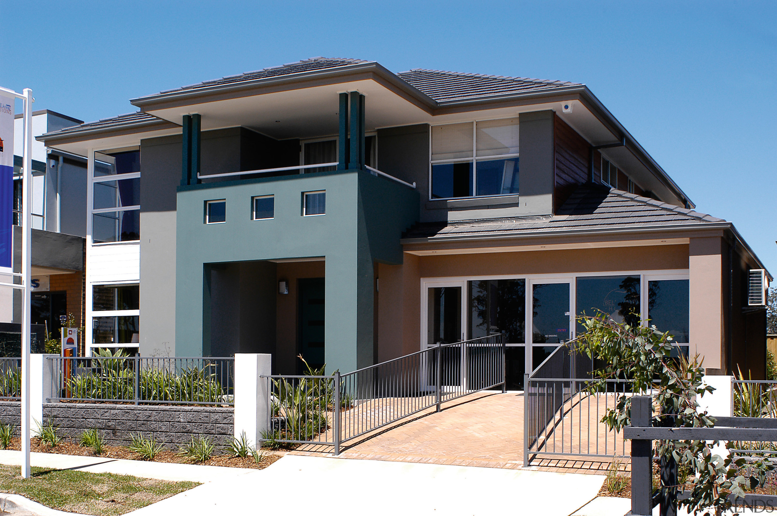 Exterior view of two-storey home with mortar cladding, apartment, architecture, building, condominium, elevation, estate, facade, home, house, neighbourhood, property, real estate, residential area, roof, villa, black