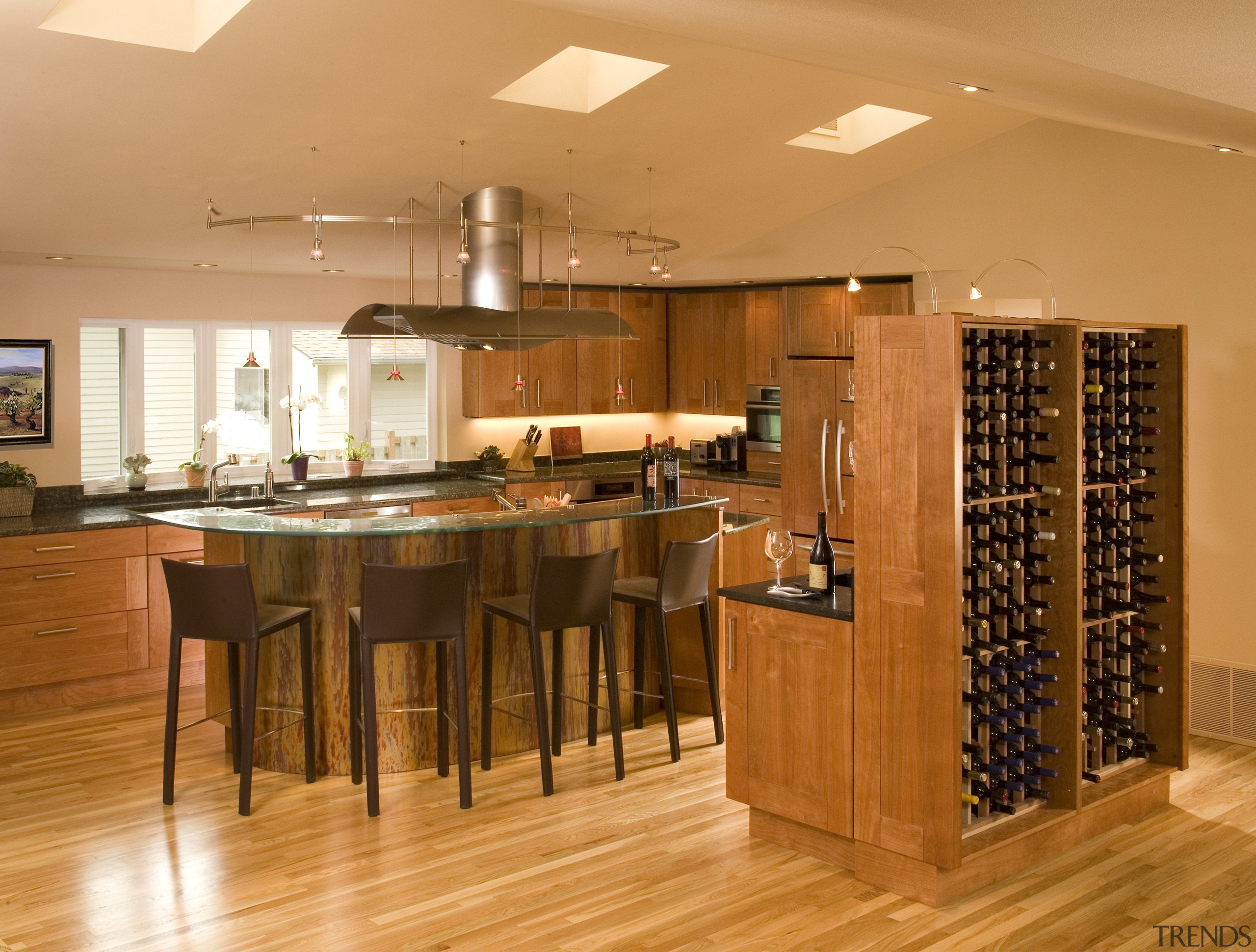 A view of a kitchen designed by Richard cabinetry, countertop, dining room, floor, flooring, hardwood, interior design, kitchen, laminate flooring, room, wood, wood flooring, orange, brown