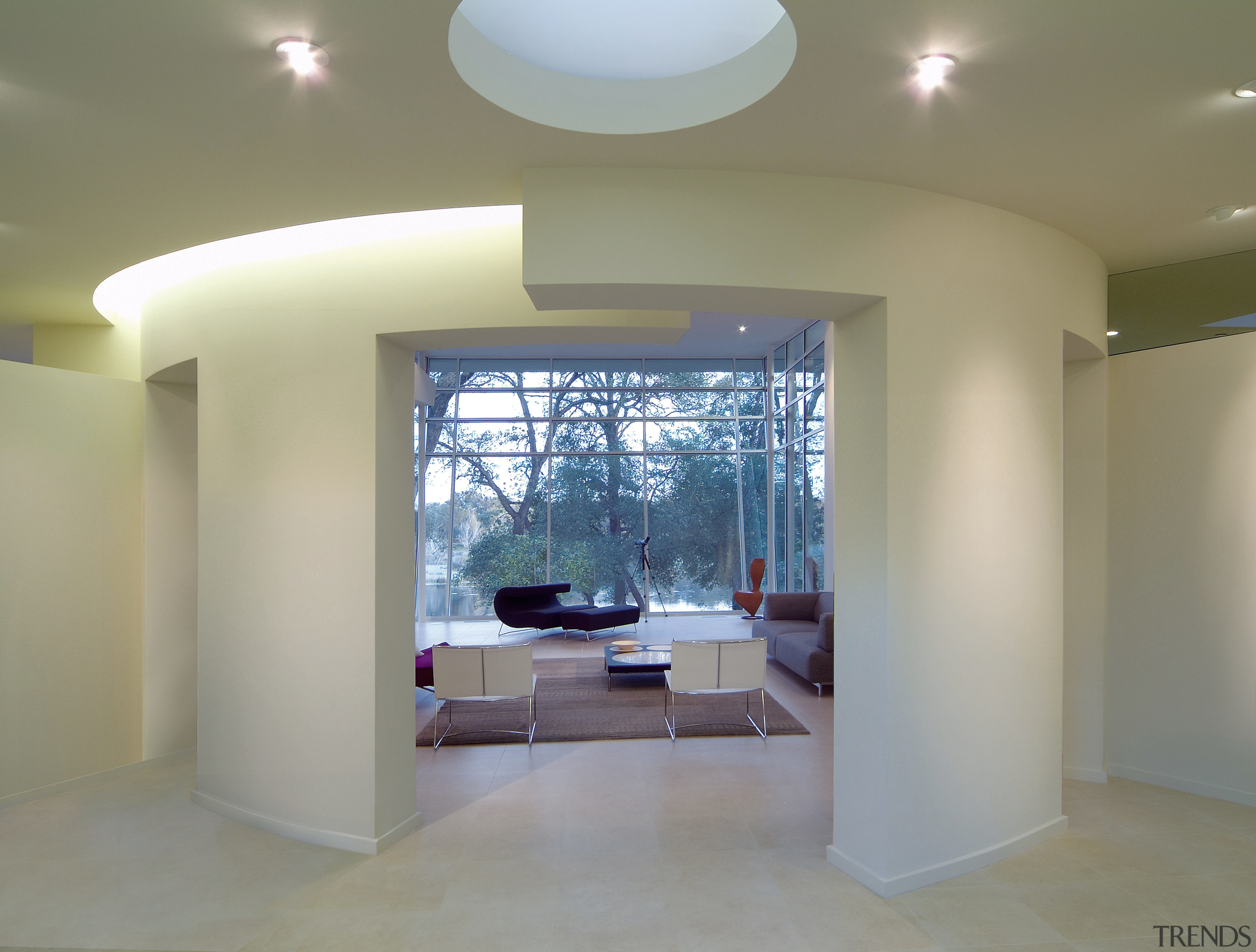 A view of the living areas, white walls, architecture, ceiling, daylighting, floor, flooring, interior design, lobby, real estate, window, gray