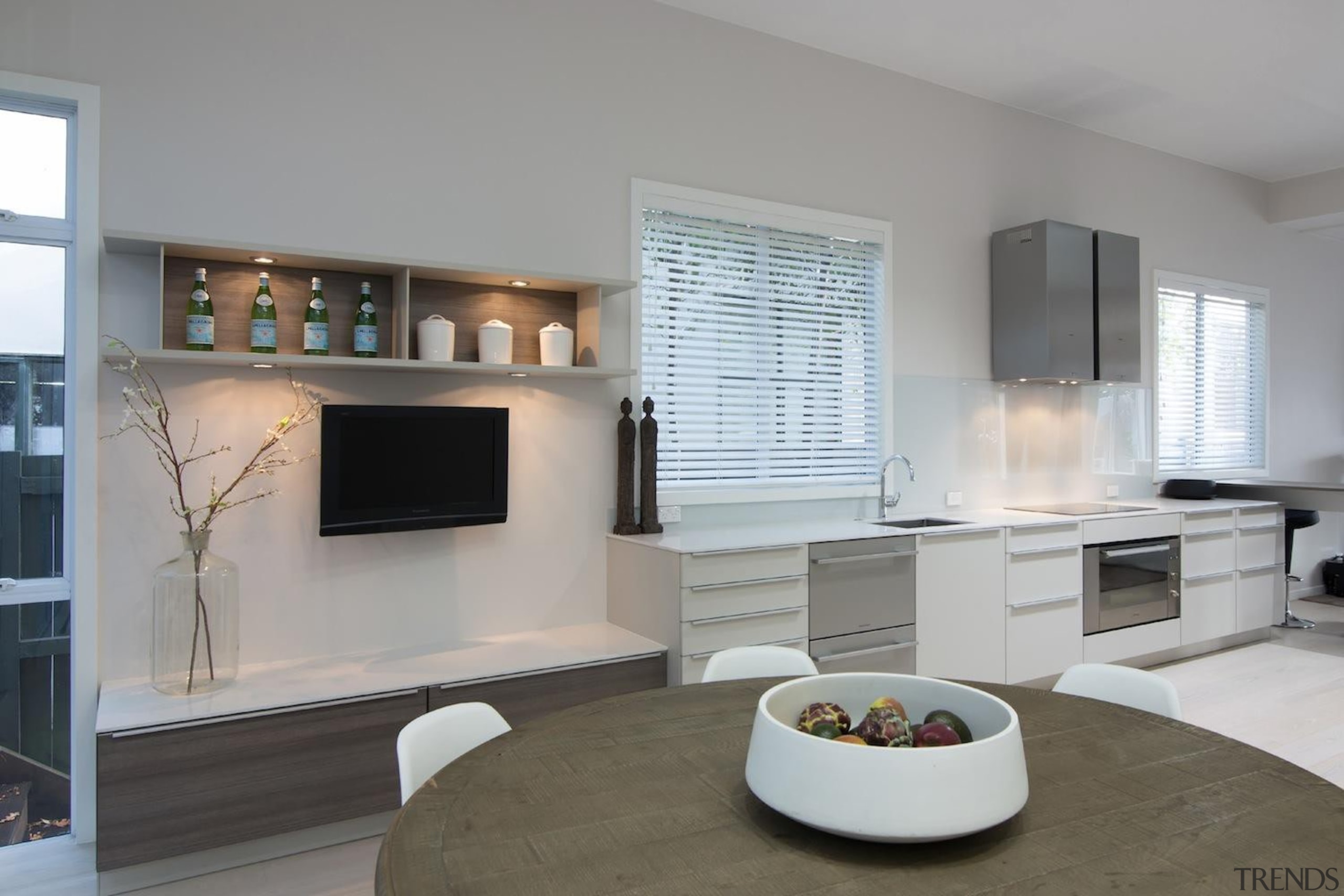 There is a wealth of bench top space hearth, interior design, living room, real estate, room, table, window, gray