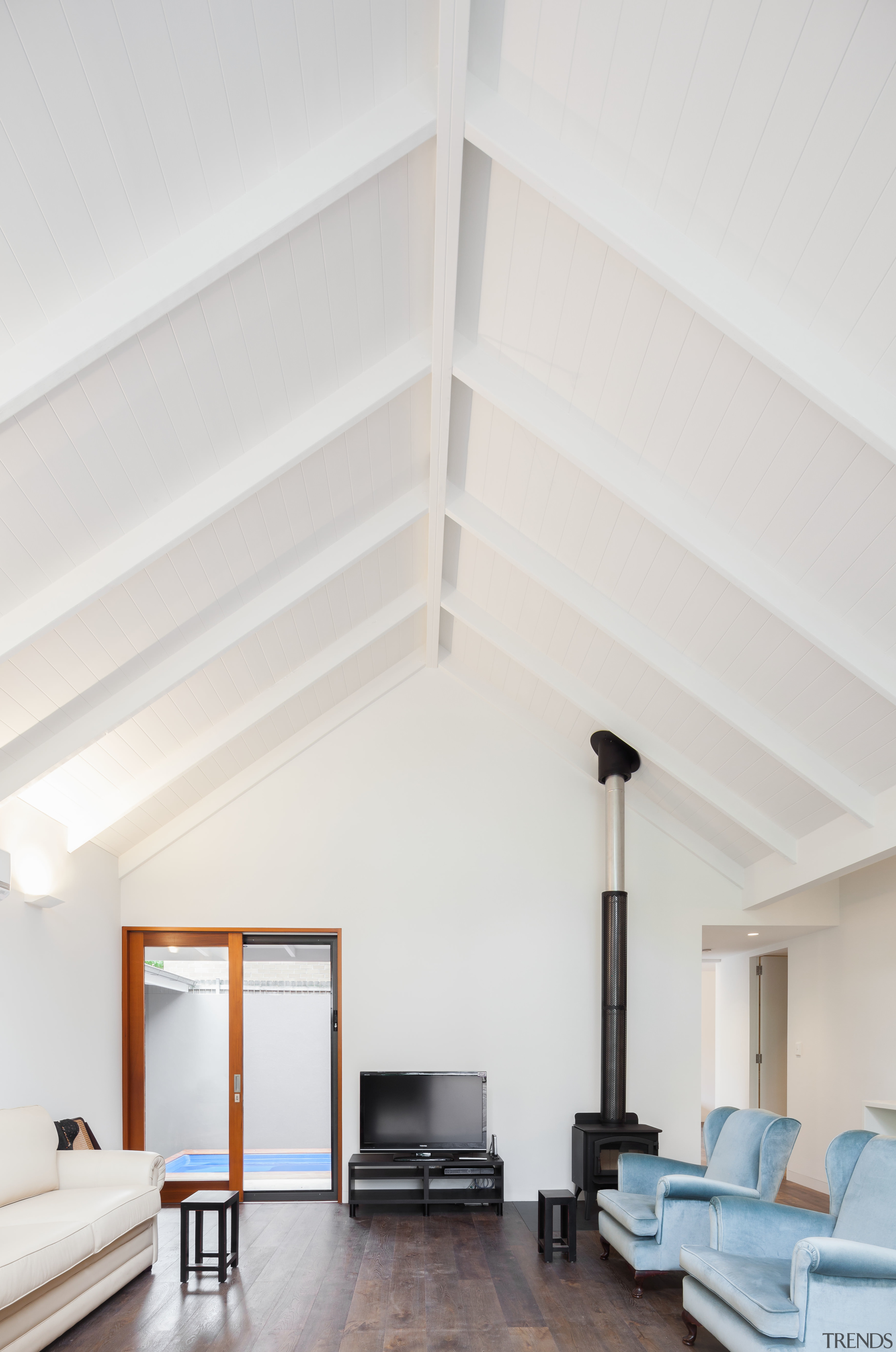 Reminiscent of a Japanese courtyard house, this house architecture, ceiling, daylighting, floor, home, house, interior design, laminate flooring, loft, structure, wall, white