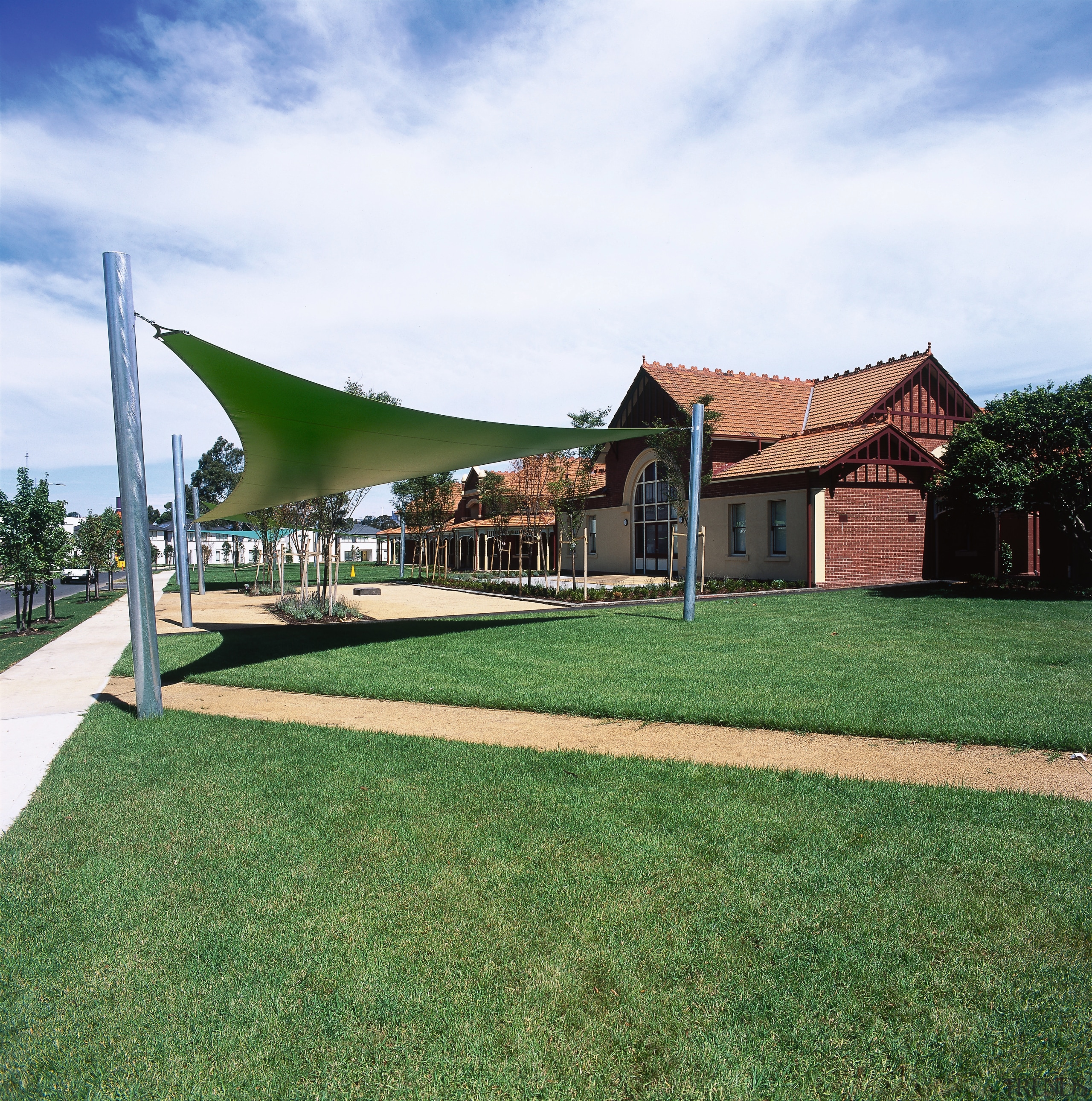 Historical brick building now part of the Commonwealth cottage, estate, farmhouse, grass, home, house, land lot, landscape, lawn, property, real estate, shade, yard, green, white