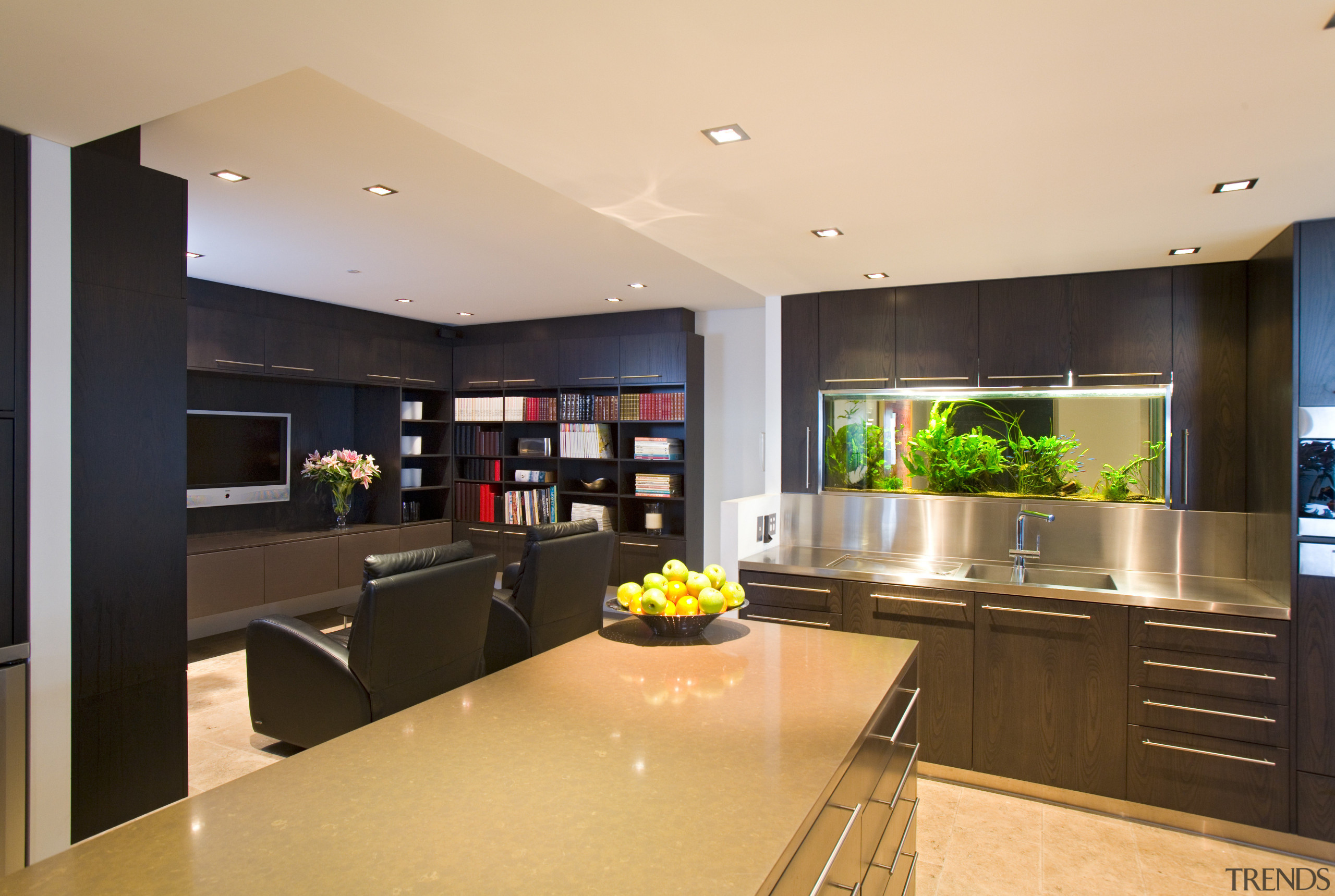 Appliances and services are concealed within the cabinetry, countertop, interior design, kitchen, real estate, room, orange