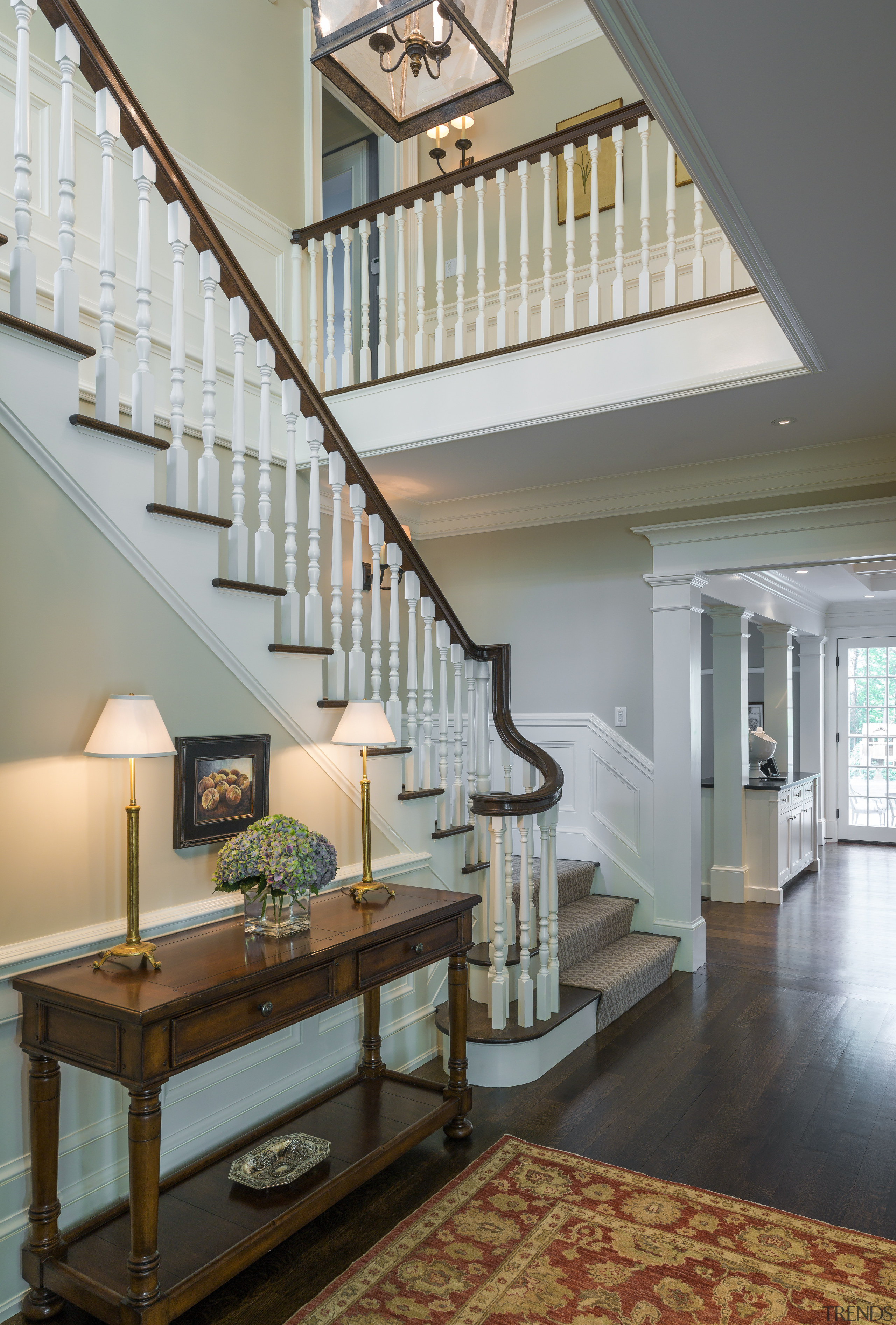 Traditional balustrading is a feature of the central architecture, baluster, ceiling, daylighting, estate, floor, flooring, handrail, hardwood, home, interior design, living room, lobby, real estate, stairs, wall, gray