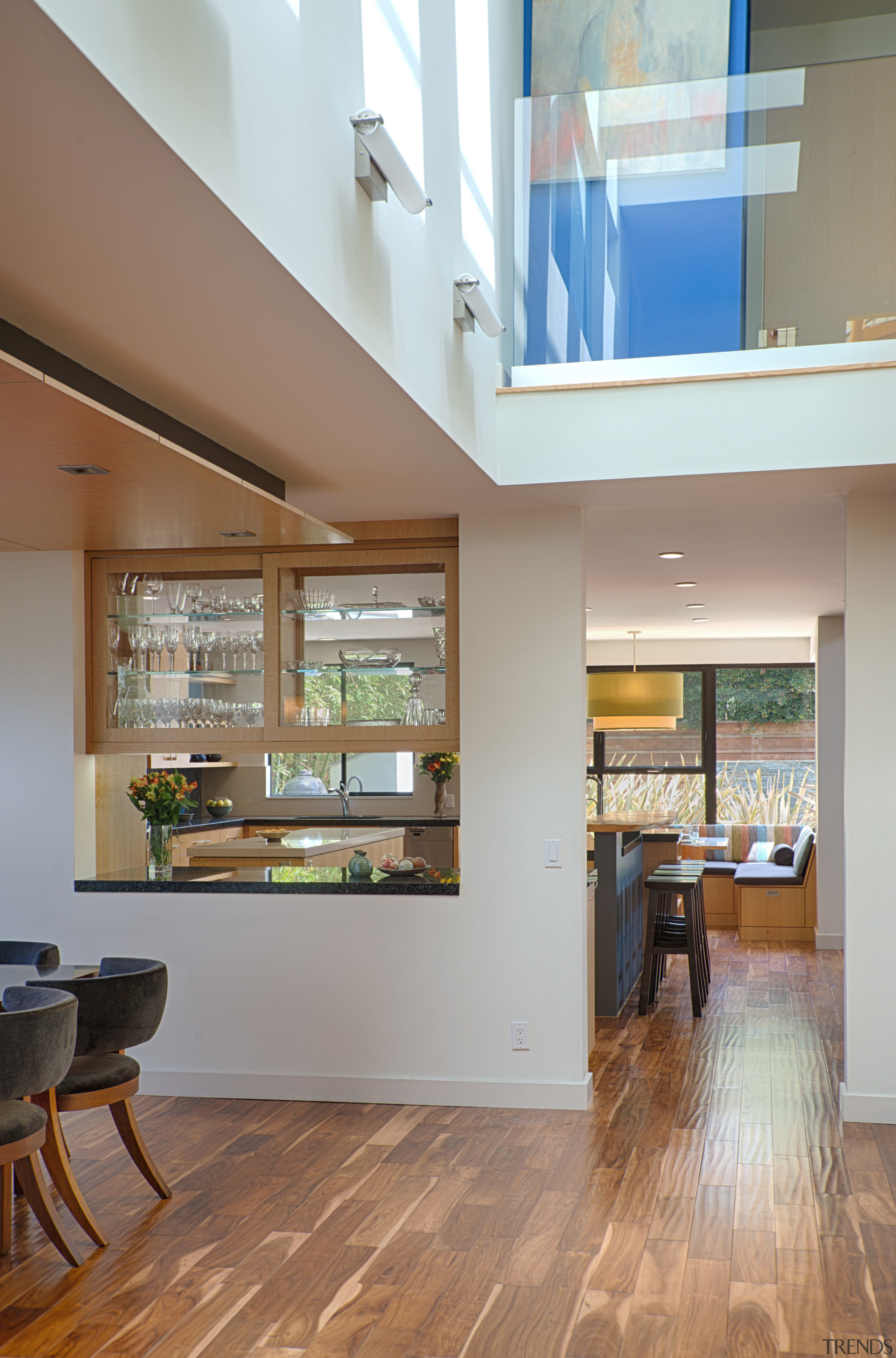 The formal dining room is next to the architecture, ceiling, daylighting, floor, flooring, hardwood, house, interior design, laminate flooring, lobby, real estate, window, wood, wood flooring, gray, brown