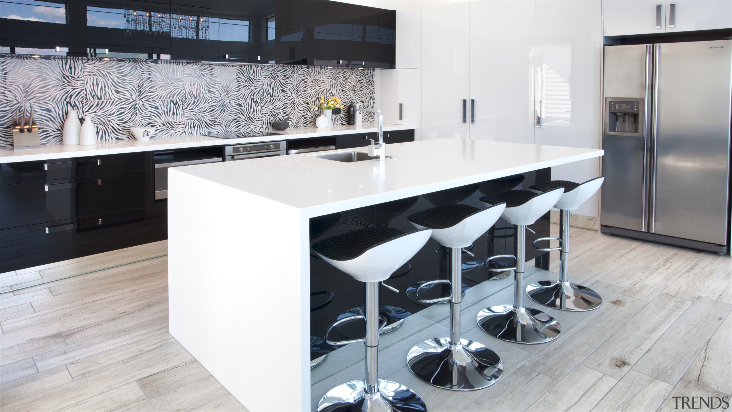 Crisp white Corian countertops and black high gloss countertop, floor, flooring, interior design, kitchen, product design, white