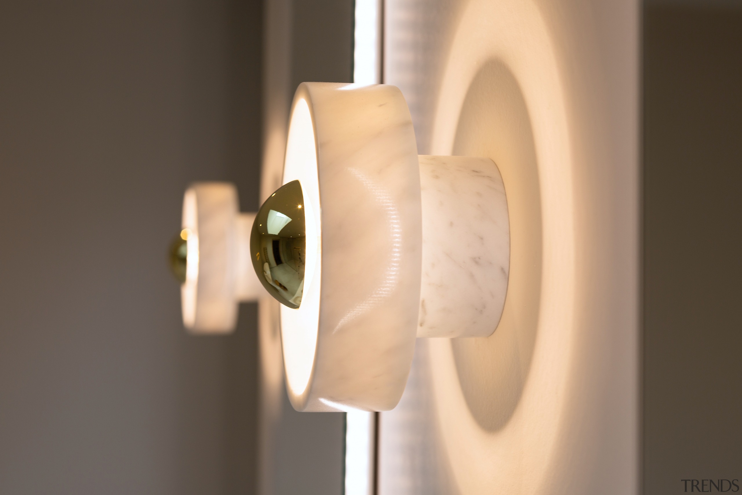 Tom Dixon marble wall lights feature above the 