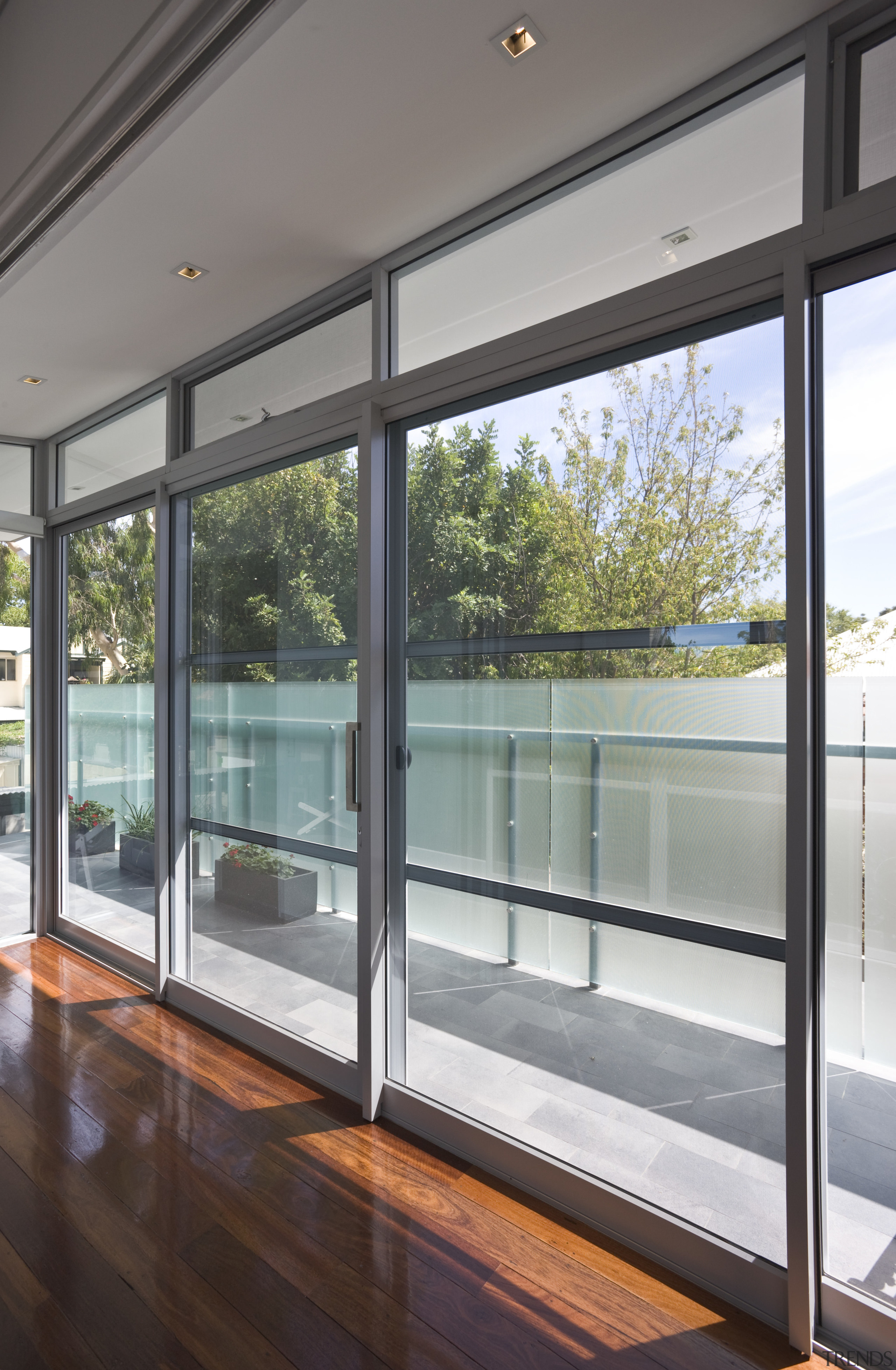 Interior view of contemporary home with deck &amp; architecture, daylighting, door, glass, house, real estate, window, gray