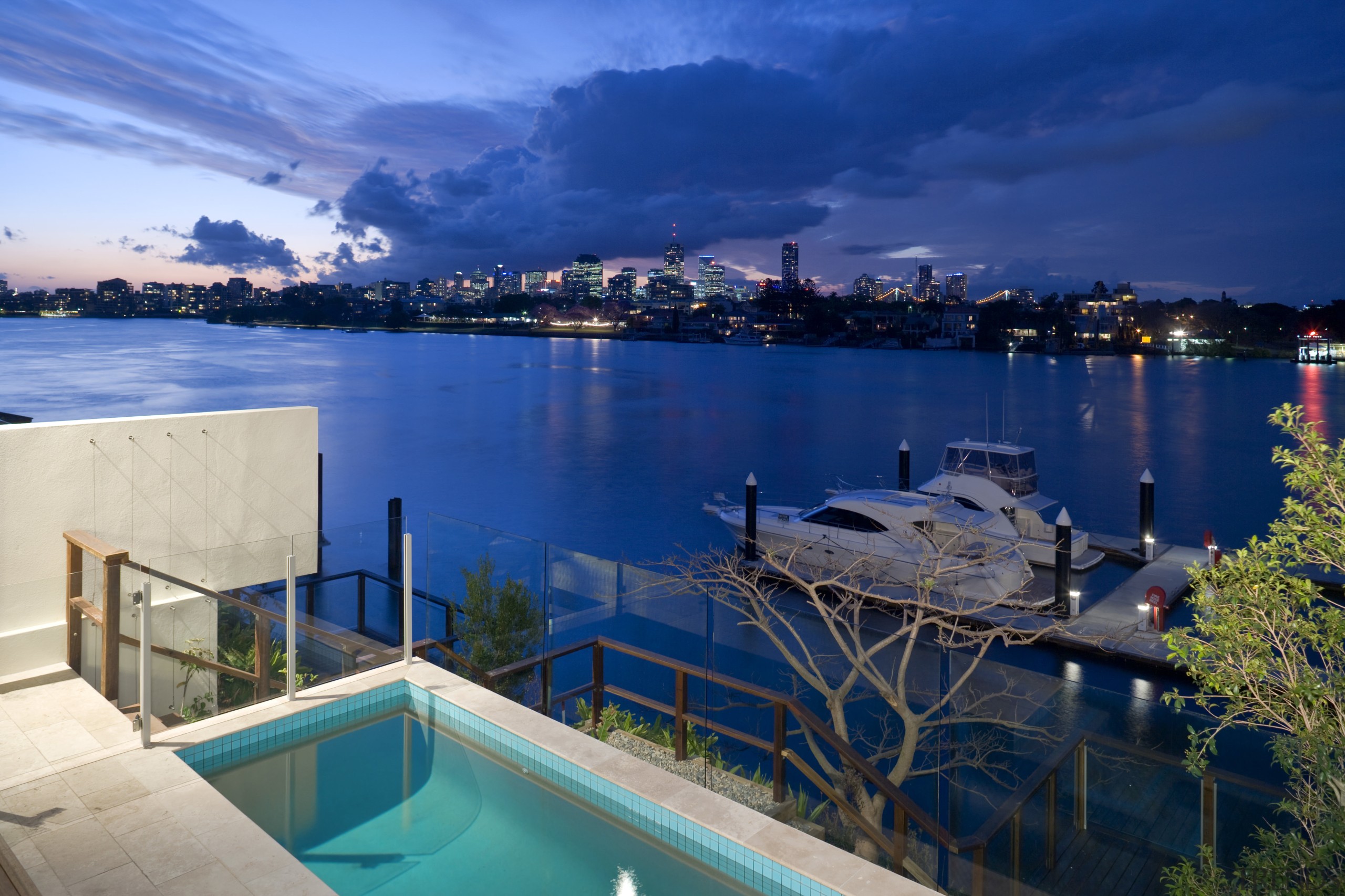 View of the Norman Reach development which is evening, leisure, marina, real estate, reflection, resort, sea, sky, swimming pool, tourism, vacation, water, blue