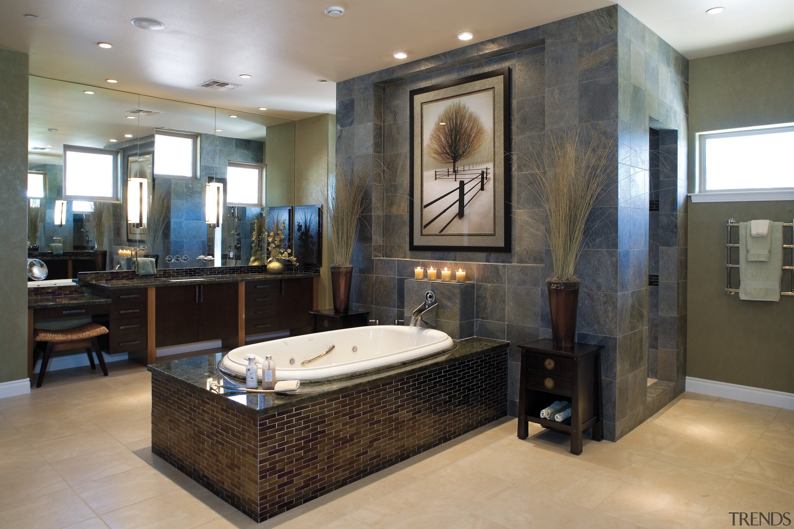 A view of the bathrooms featuring recessed bathtubs, bathroom, ceiling, floor, flooring, interior design, room, gray, black