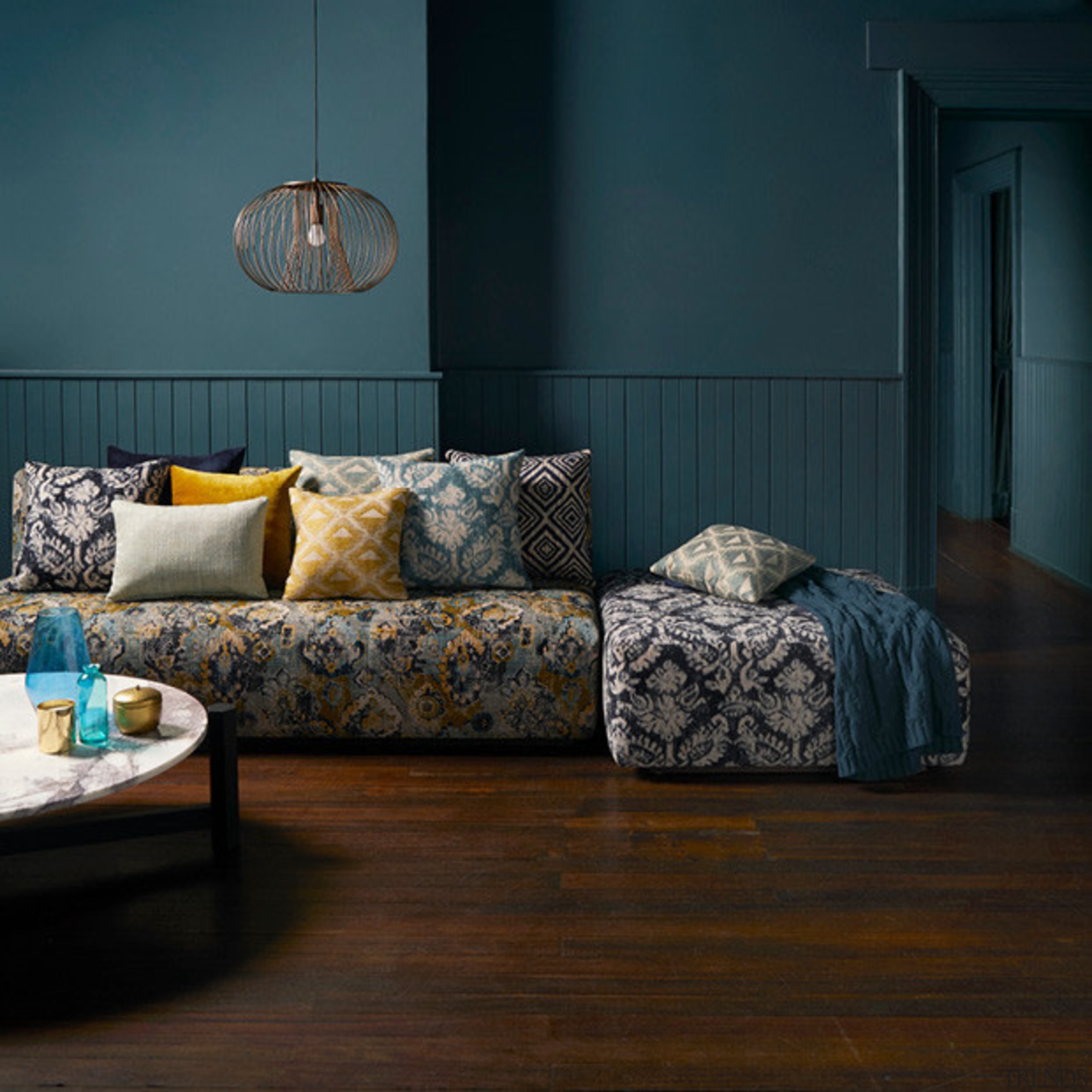 Persian influences and modern interpretations of textured weaves, couch, floor, flooring, furniture, hardwood, home, interior design, living room, room, table, wall, wood, black