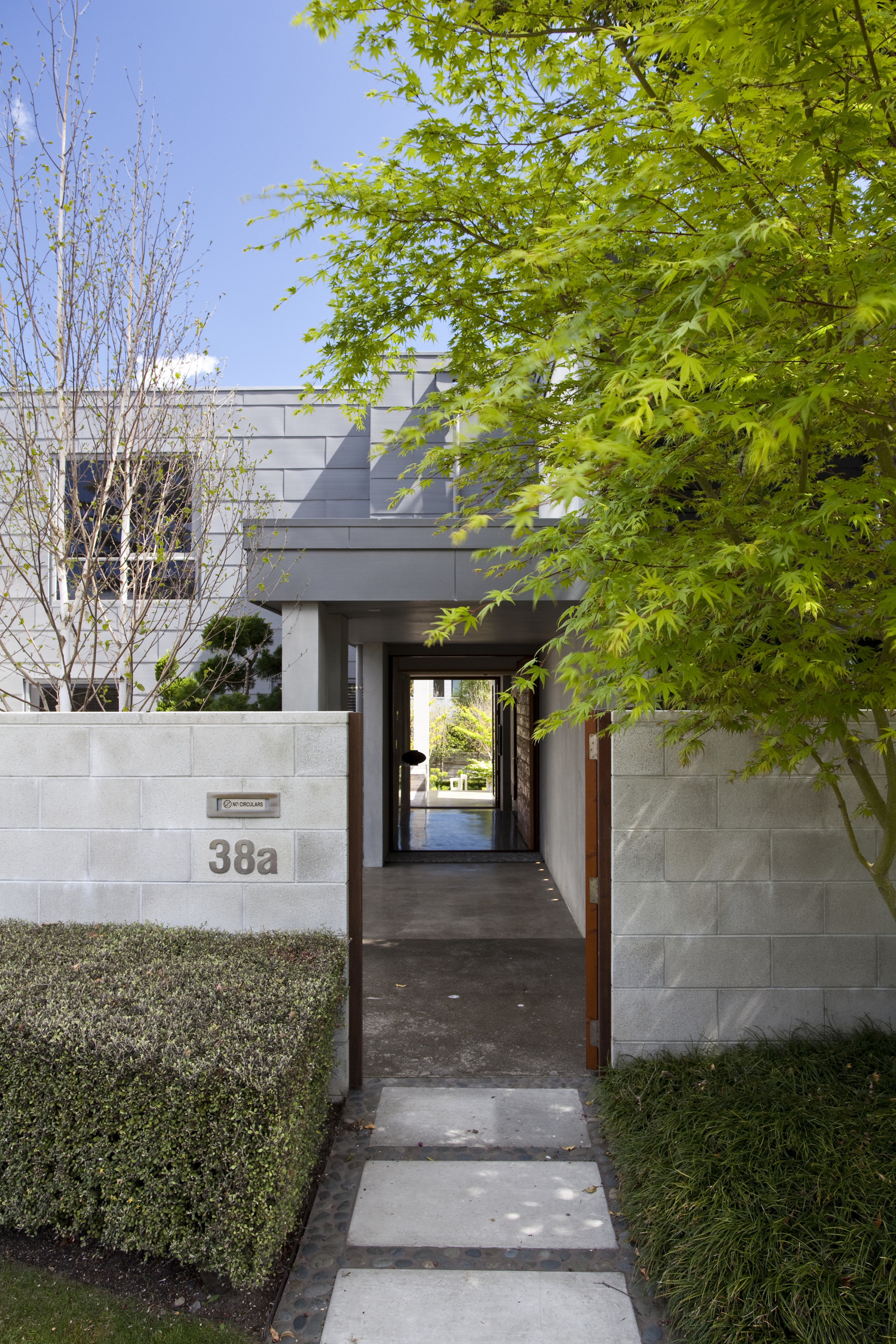 Exterior view of flat roof house which is architecture, cottage, estate, facade, grass, home, house, neighbourhood, real estate, residential area, tree, walkway, brown, gray