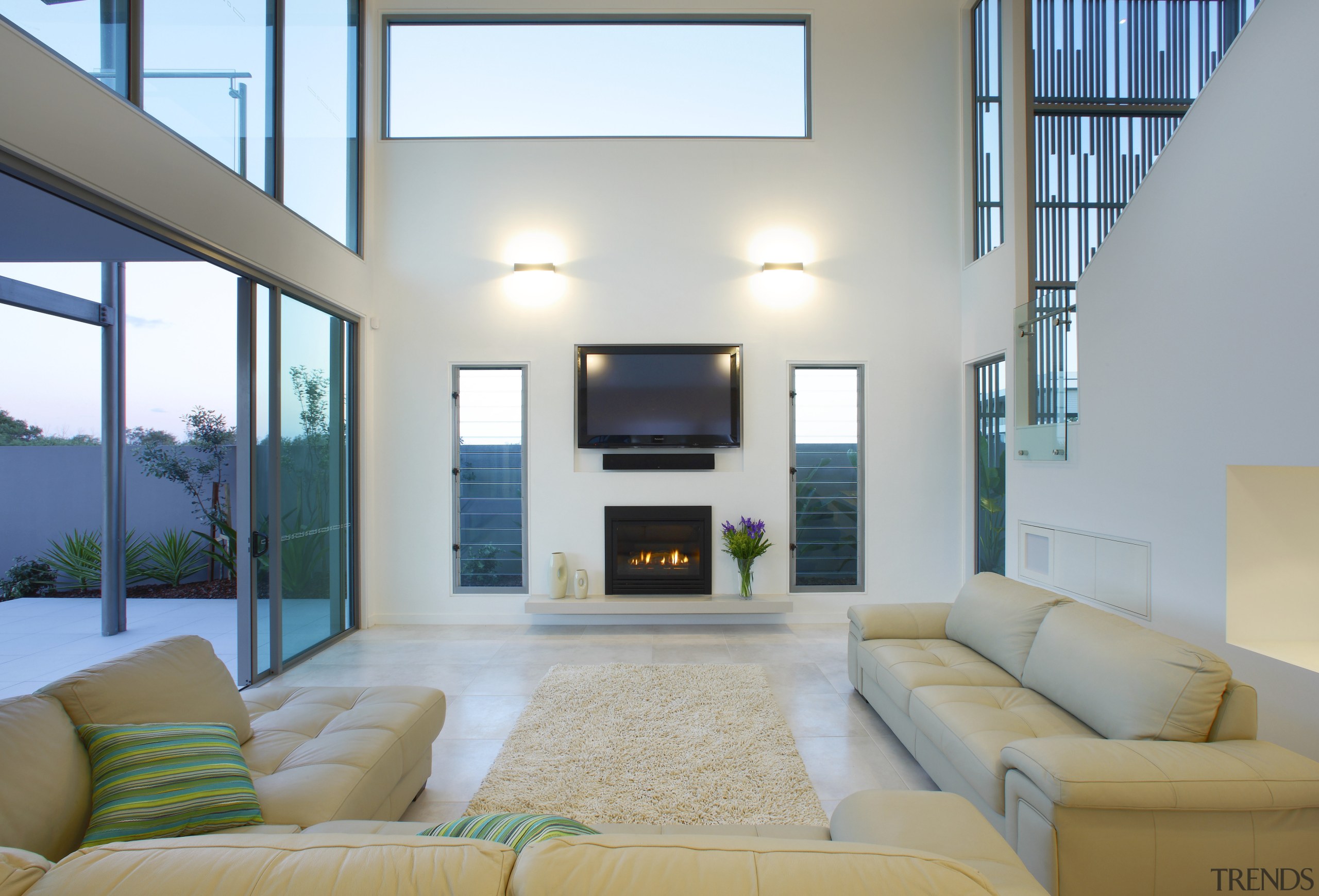 Interior view of at double-height living area which ceiling, daylighting, home, interior design, living room, real estate, room, window, gray