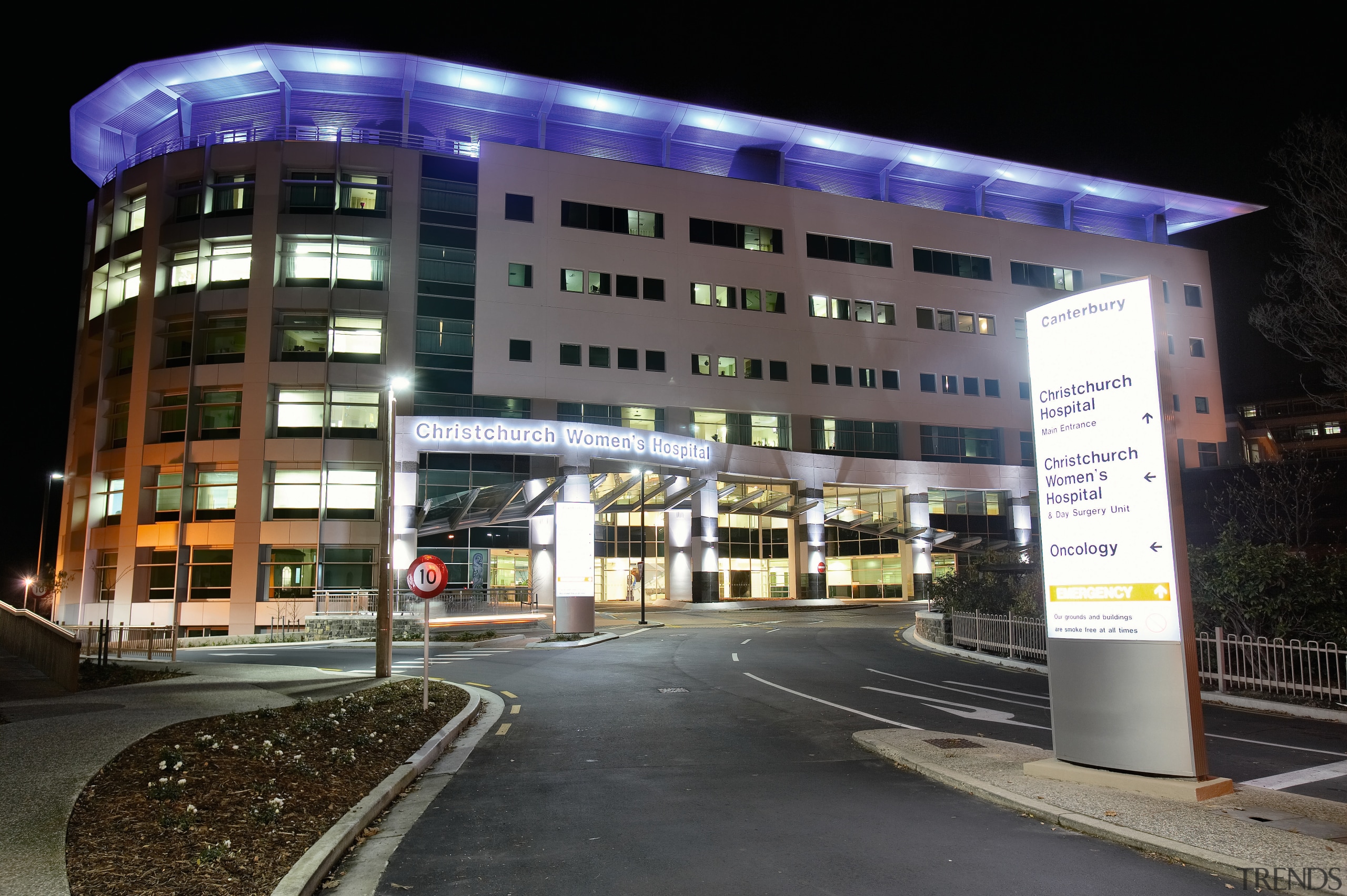 Night view of new hospital complex with blue building, city, commercial building, condominium, corporate headquarters, hotel, metropolitan area, mixed use, night, black